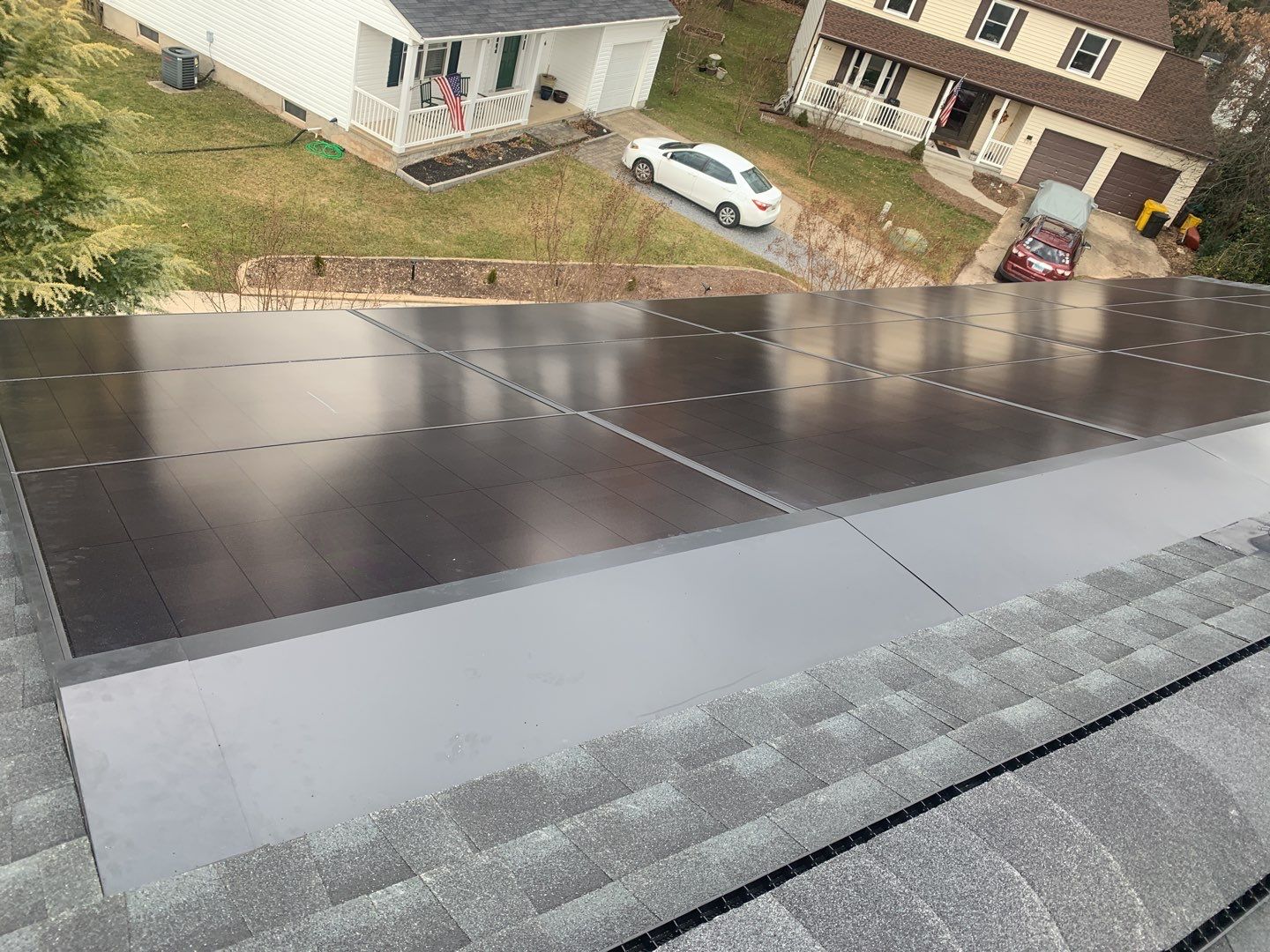 Roof Replacement with GAF Decotech integrated solar panels by American Home Contractors