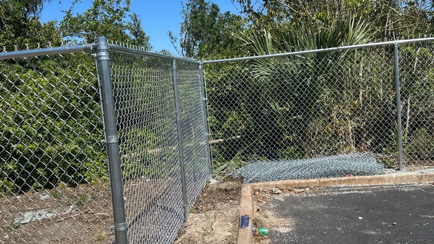 Commercial Chainlink and Vinyl Fence With Aluminum Framed Gates On Dumpster Enclosure by Asap fence and gates, LLC