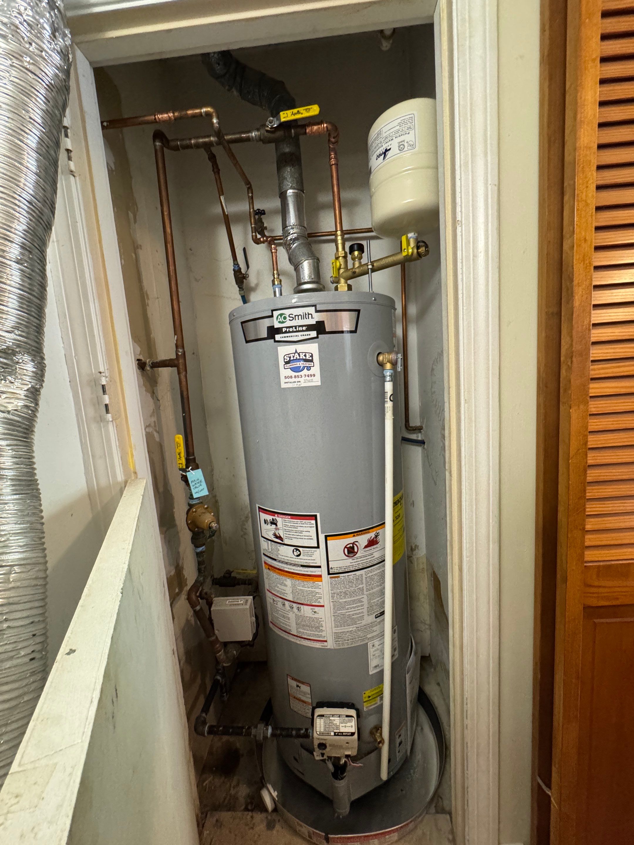 Closet Water Heater Replacement by Stake Plumbing and Heating