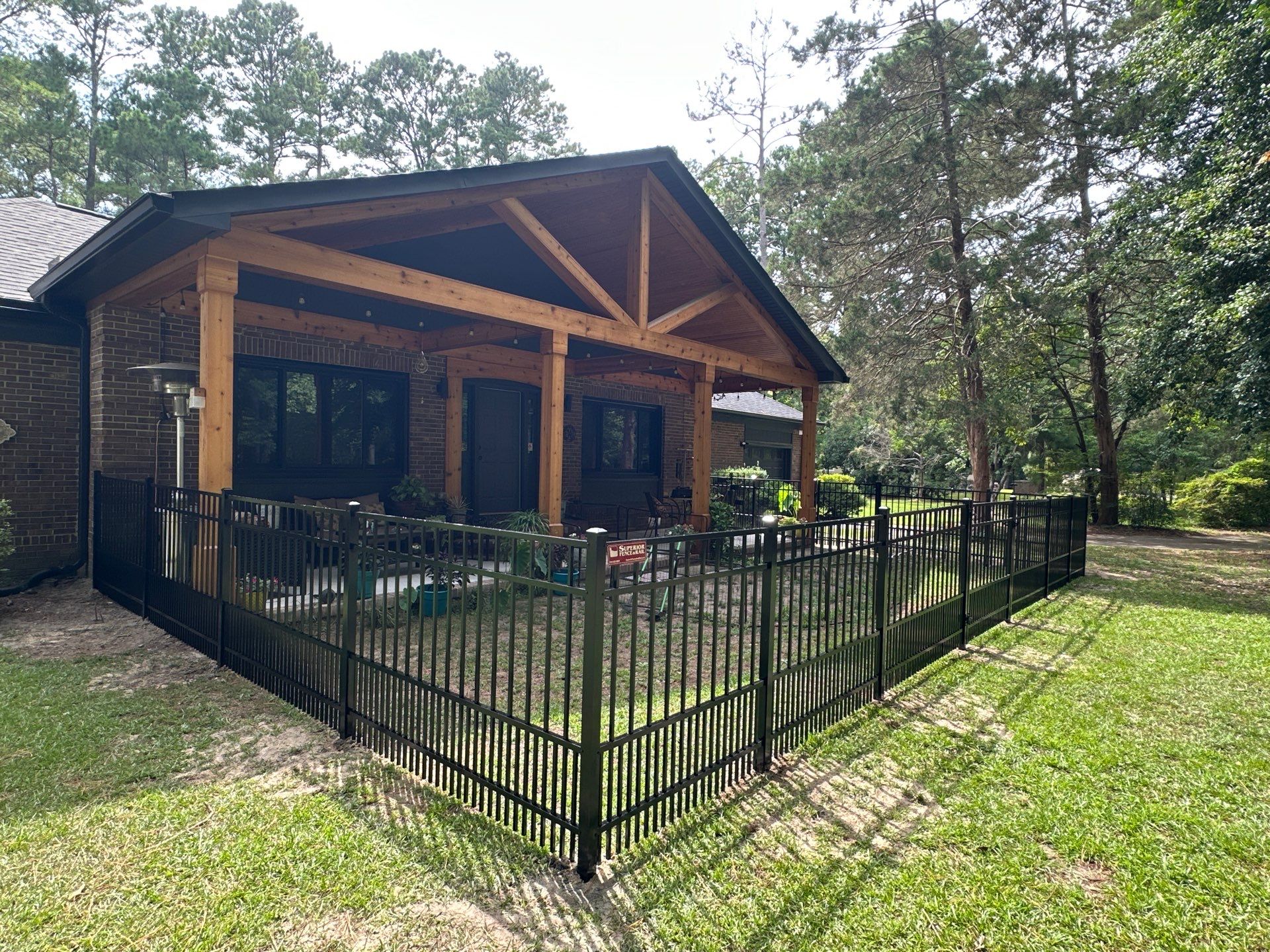Black Vinyl Privacy Fence with Puppy Picket Aluminum Installation in Roseboro by Superior Fence and Rail