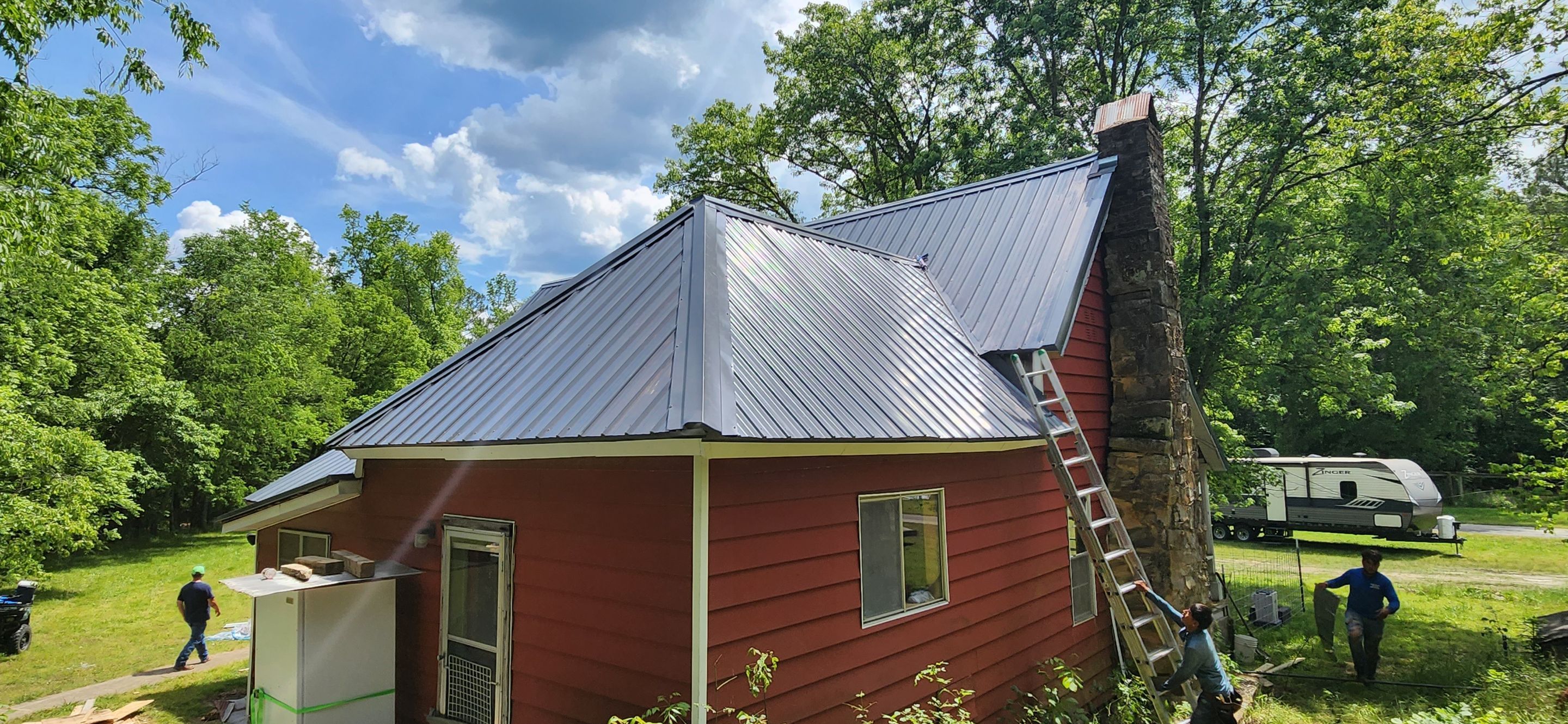 Residential Roofing Installation using 26 Gauge Colored Panels by Hostetler Roofing