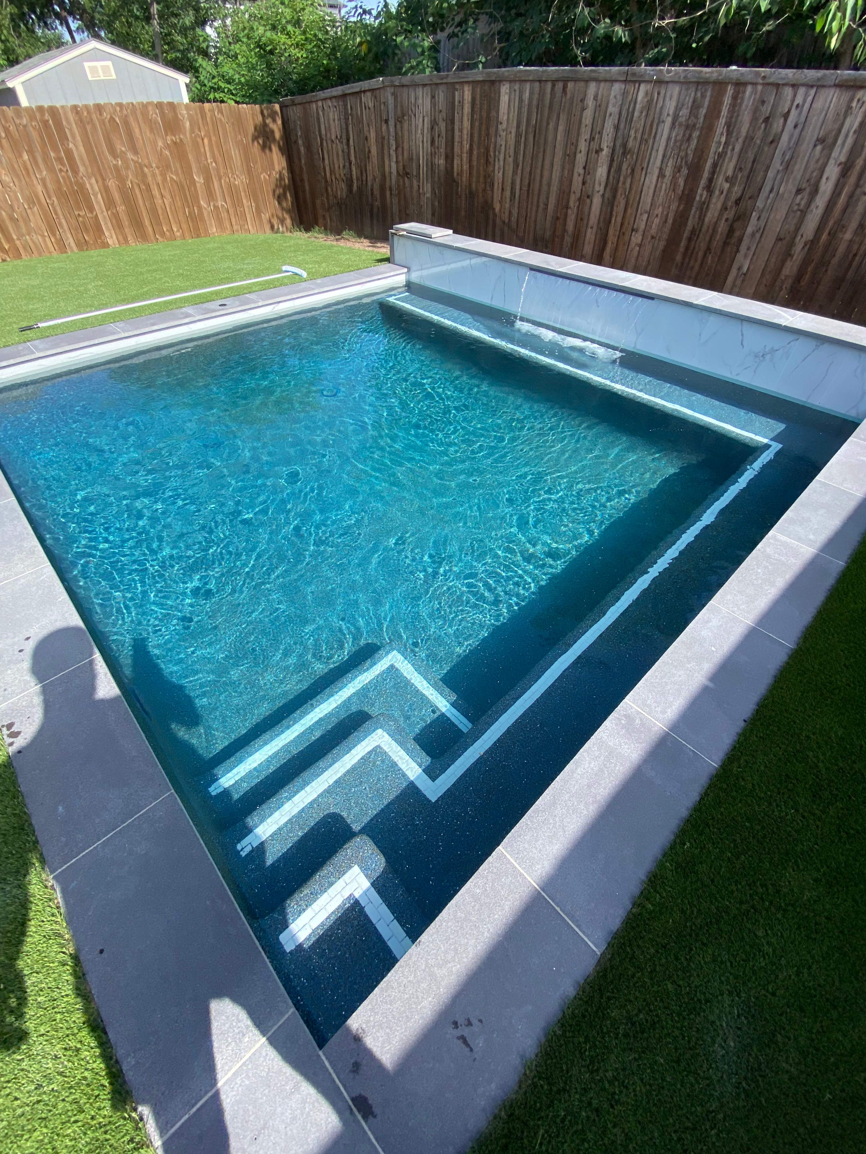 Modern Geometric Pool with Tanning Ledge and Turf by Pinnacle Pools and Spas - DFW