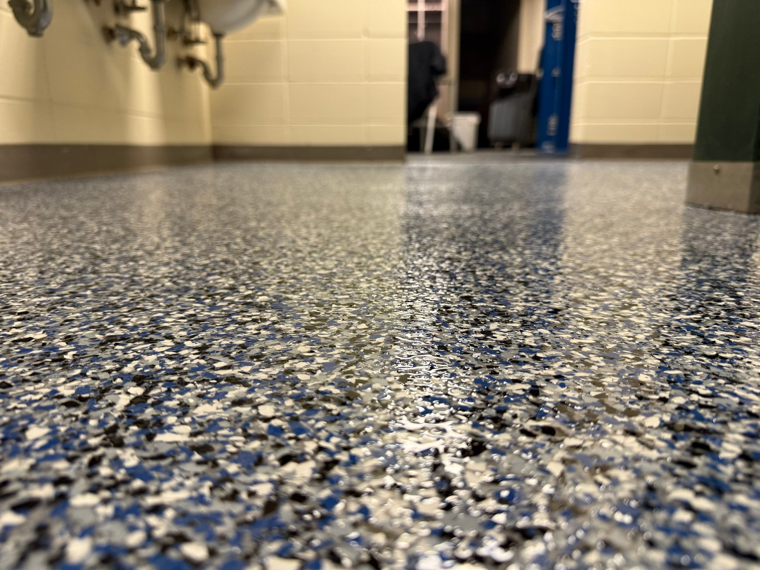Seamless Epoxy Floor Coating at the Sioux Falls Canaries Facility by Select Painting, Coatings & Garage Cabinets