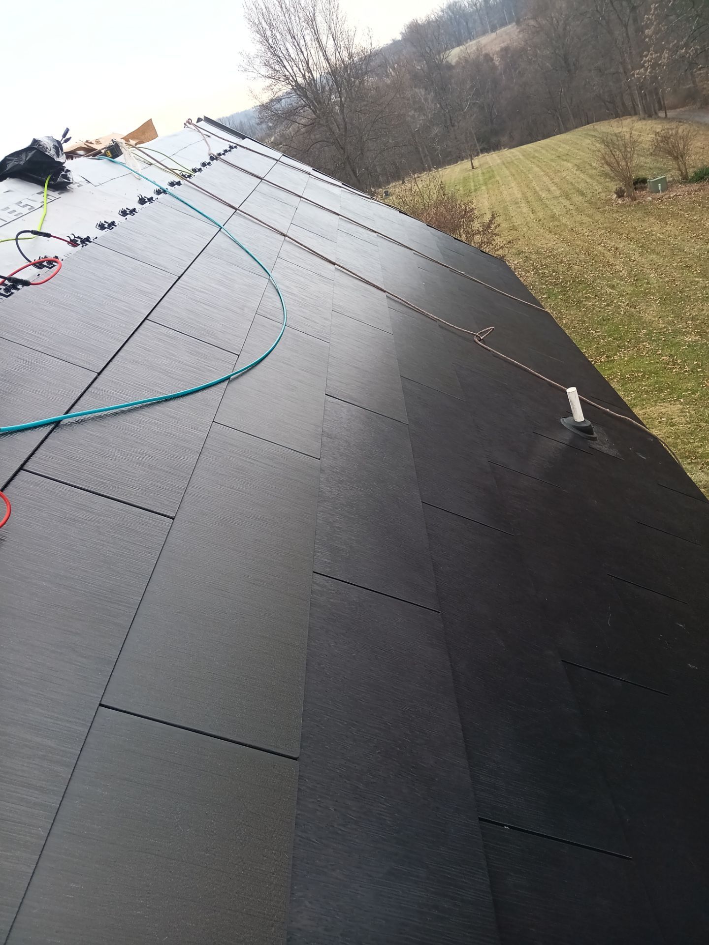 Tesla Solar Roof  using Tesla Powerwall by American Home Contractors