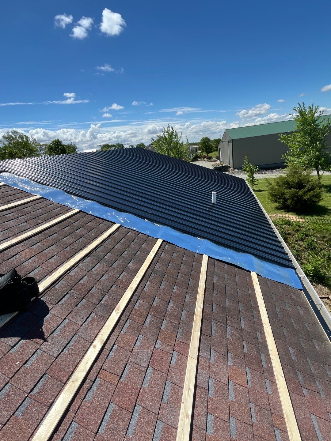 Residential Roofing Installation using Perfromance Panel Metal - Black by RoofX 