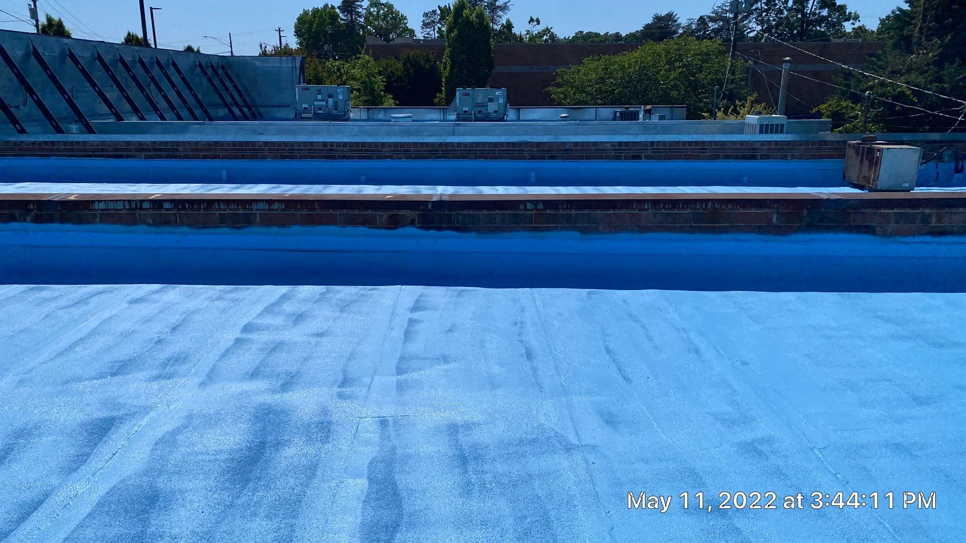 Commercial Roof Coating using Fiberseal basecoat and Silicon Topcoat by Just In Time Roofing and Restoration