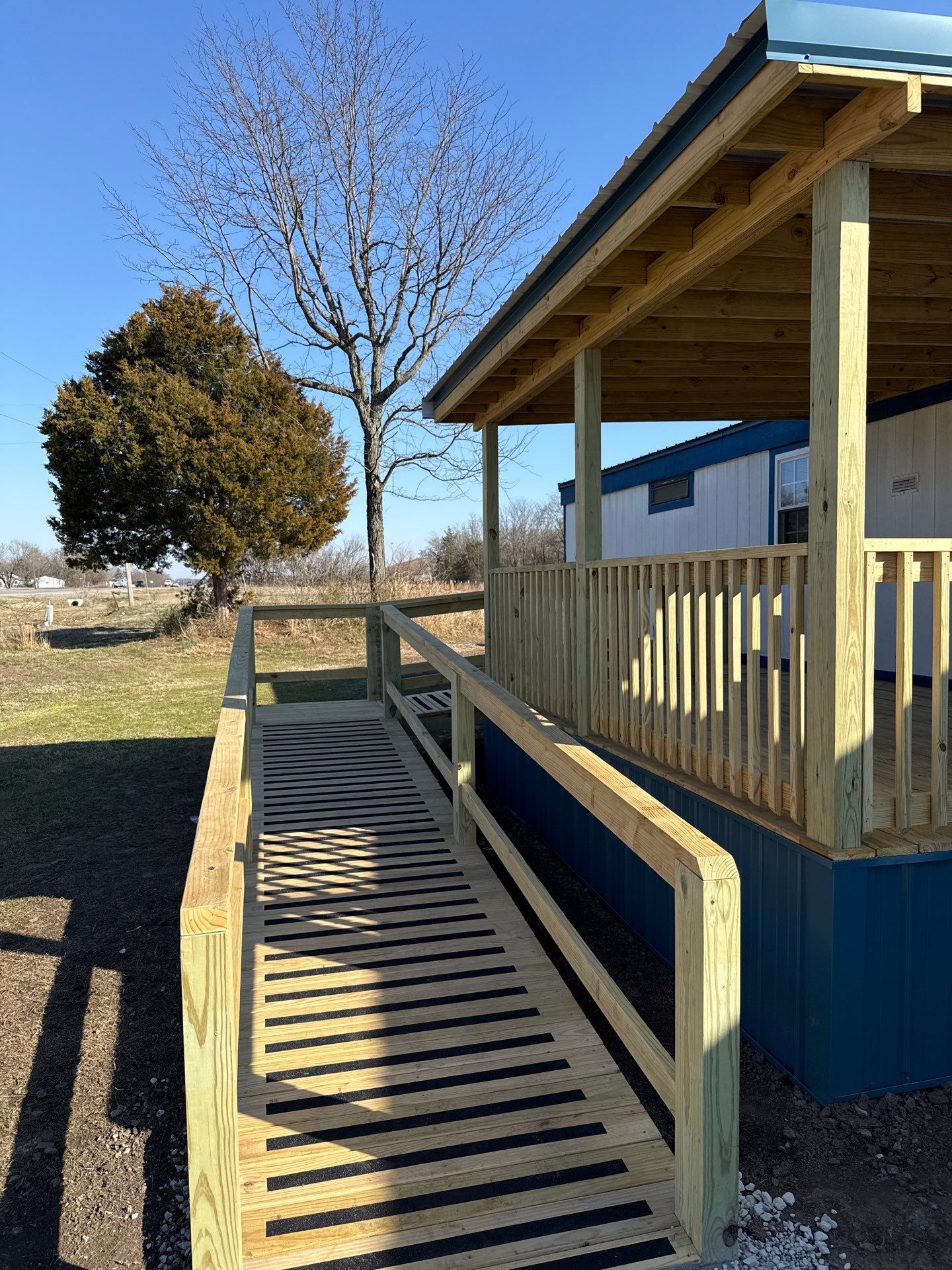 Covered Deck w/ ADA Ramp by In & Out Construction & Remodeling, LLC
