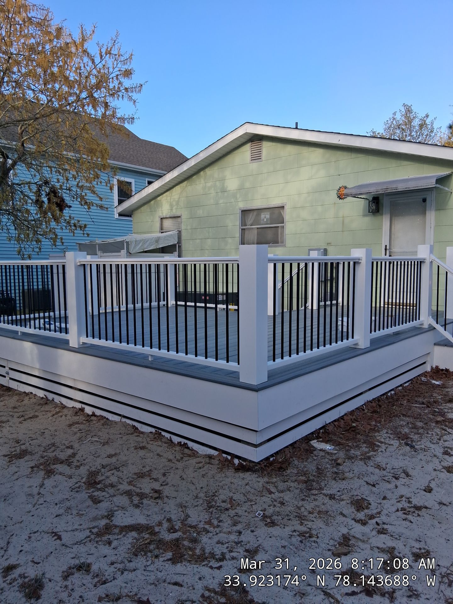 Oak Island Composite Deck Build with Trex Decking and Coastal Railings by RGR Construction and Roofing, LLC
