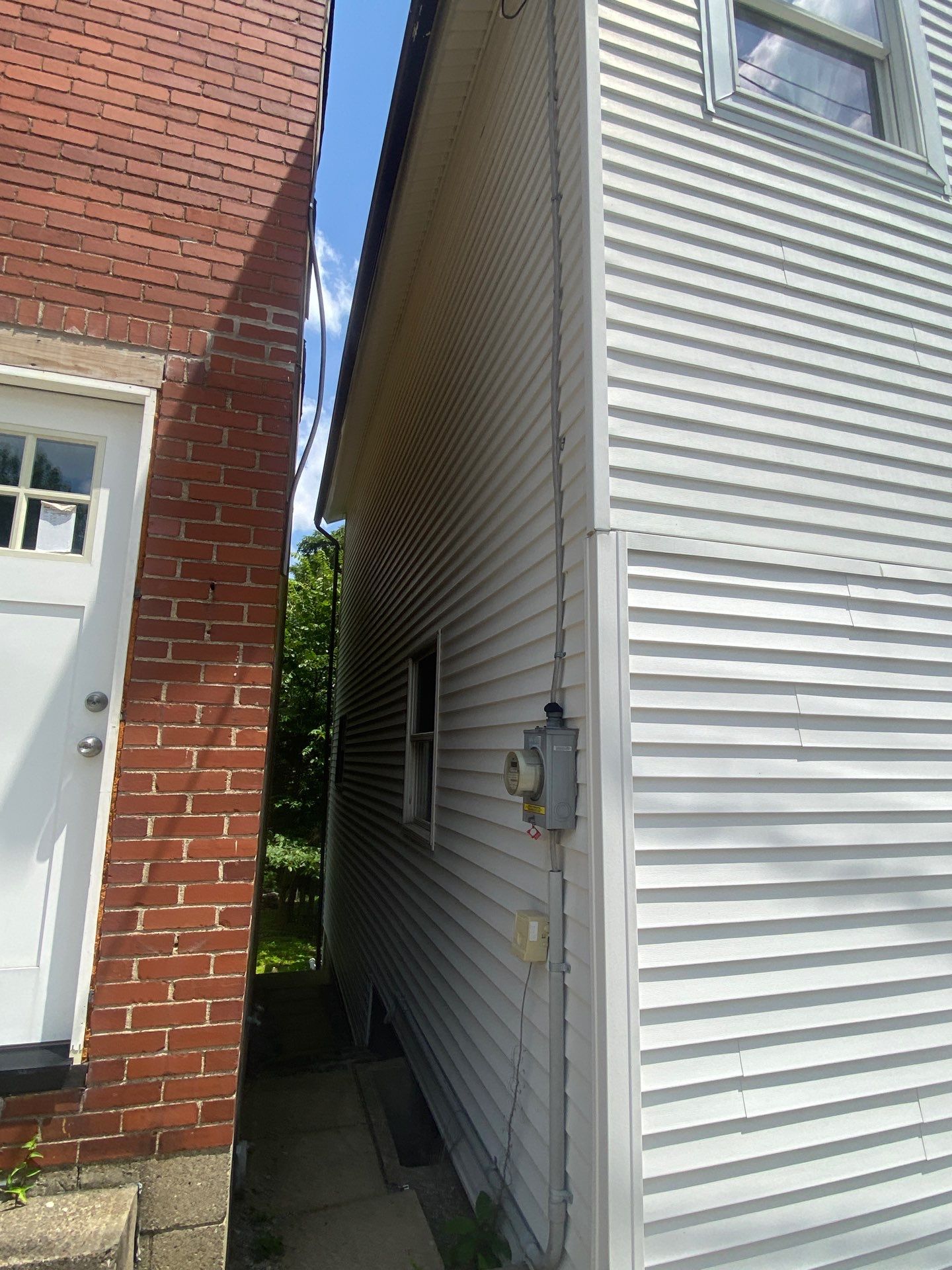 White siding  by Cousins Roofing Siding & Decks