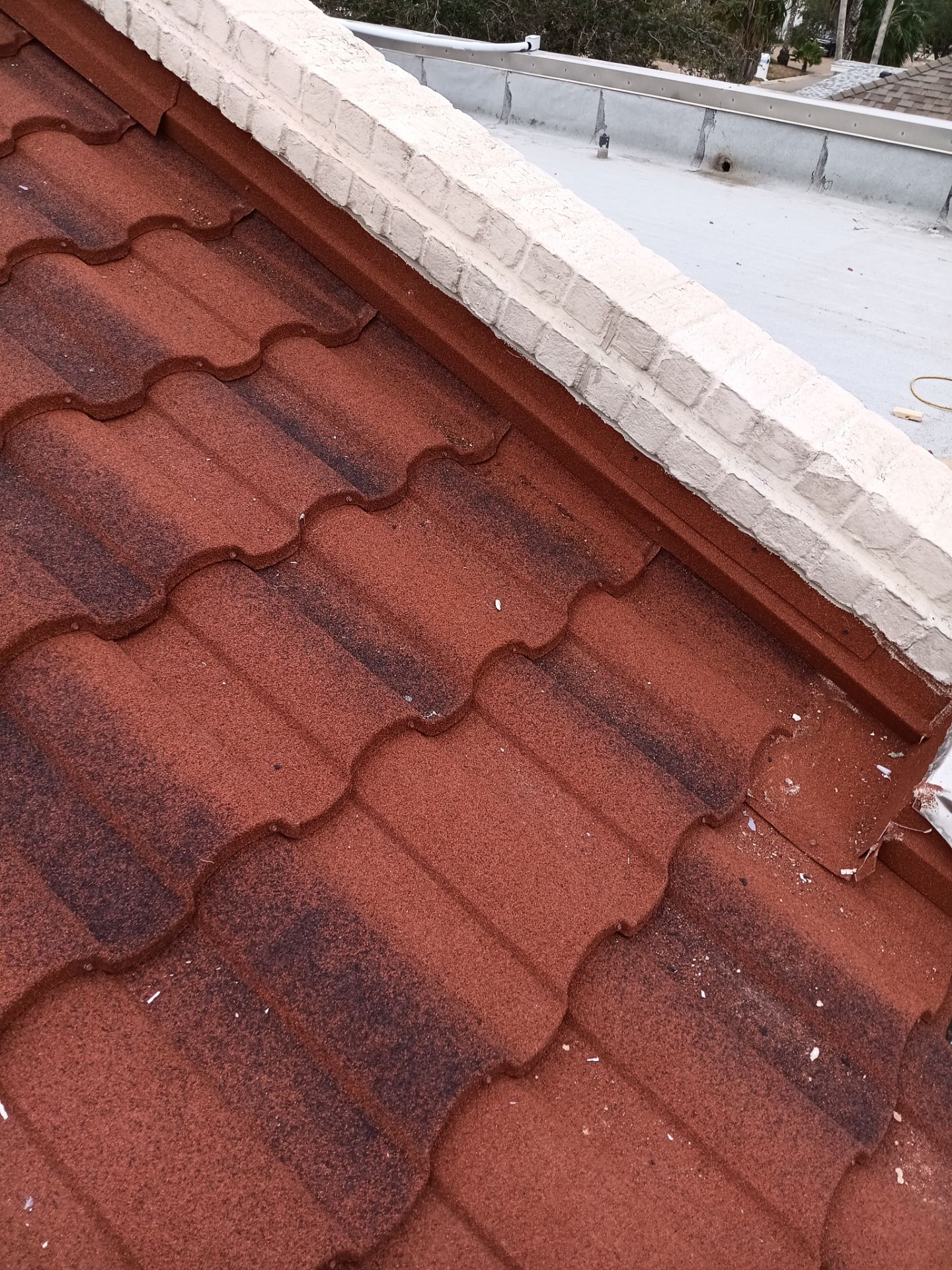Off with the Tile and on with the TILCOR stone coated metal.  by Bayfront Roofing and Construction