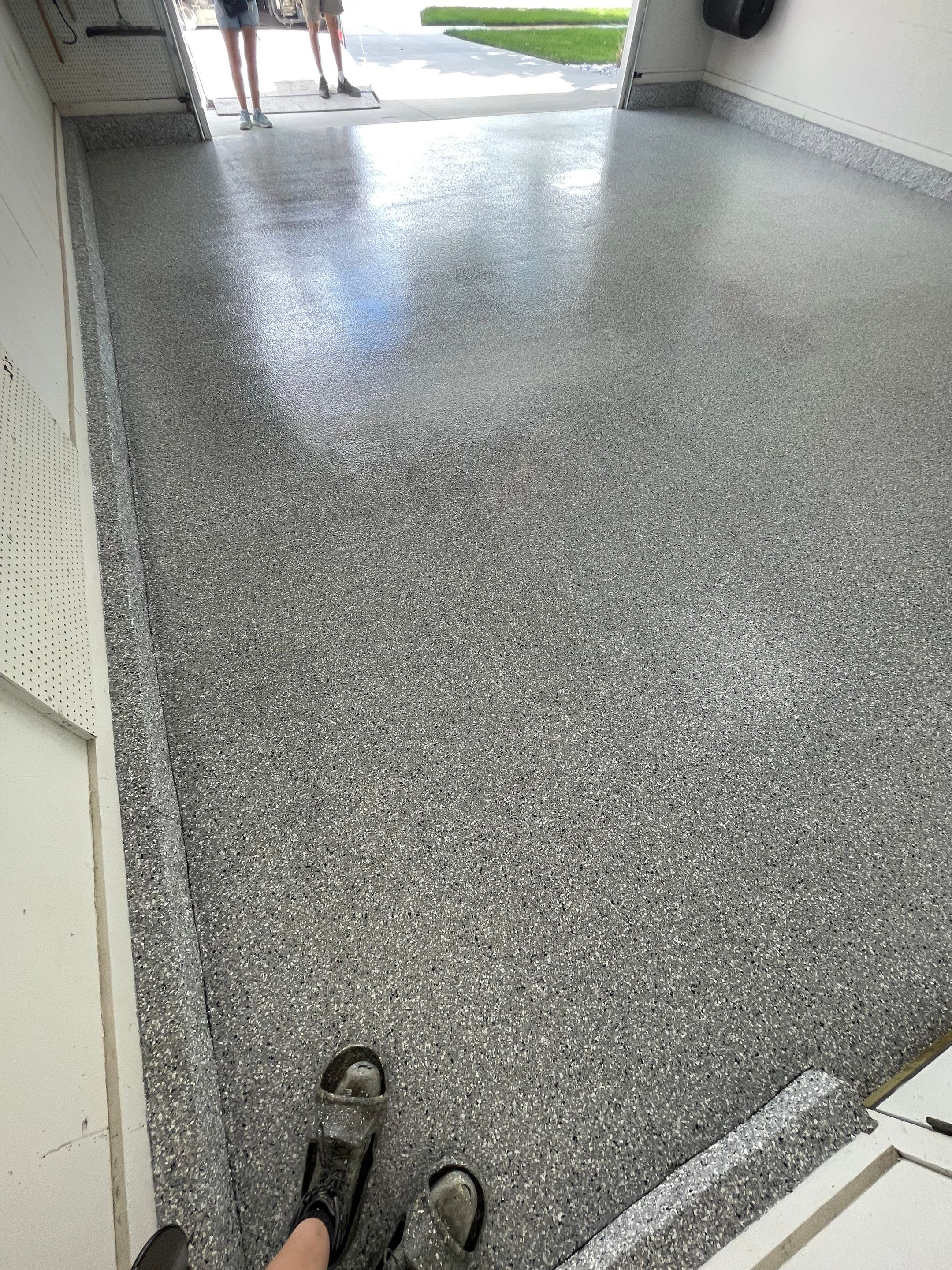 Residential Garage Floor Coating with Feather Grey Finish in Sioux Falls by Select Painting, Coatings & Garage Cabinets