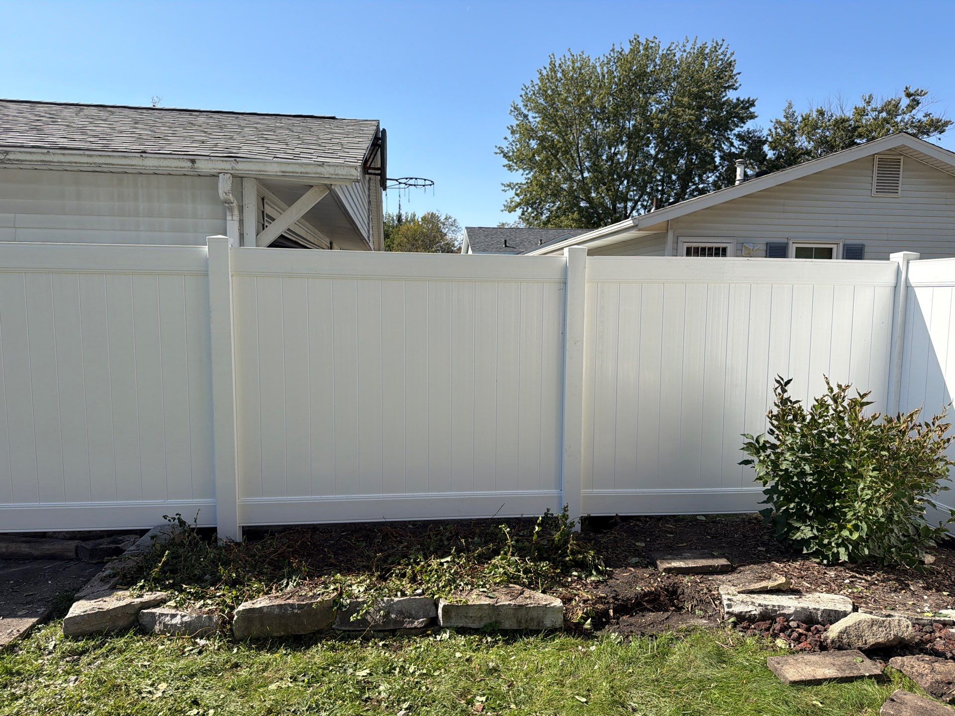 Custom Vinyl Privacy and Black Chain Link Fence Installation in Cedar Falls by Perfect Picket Fence and Stain