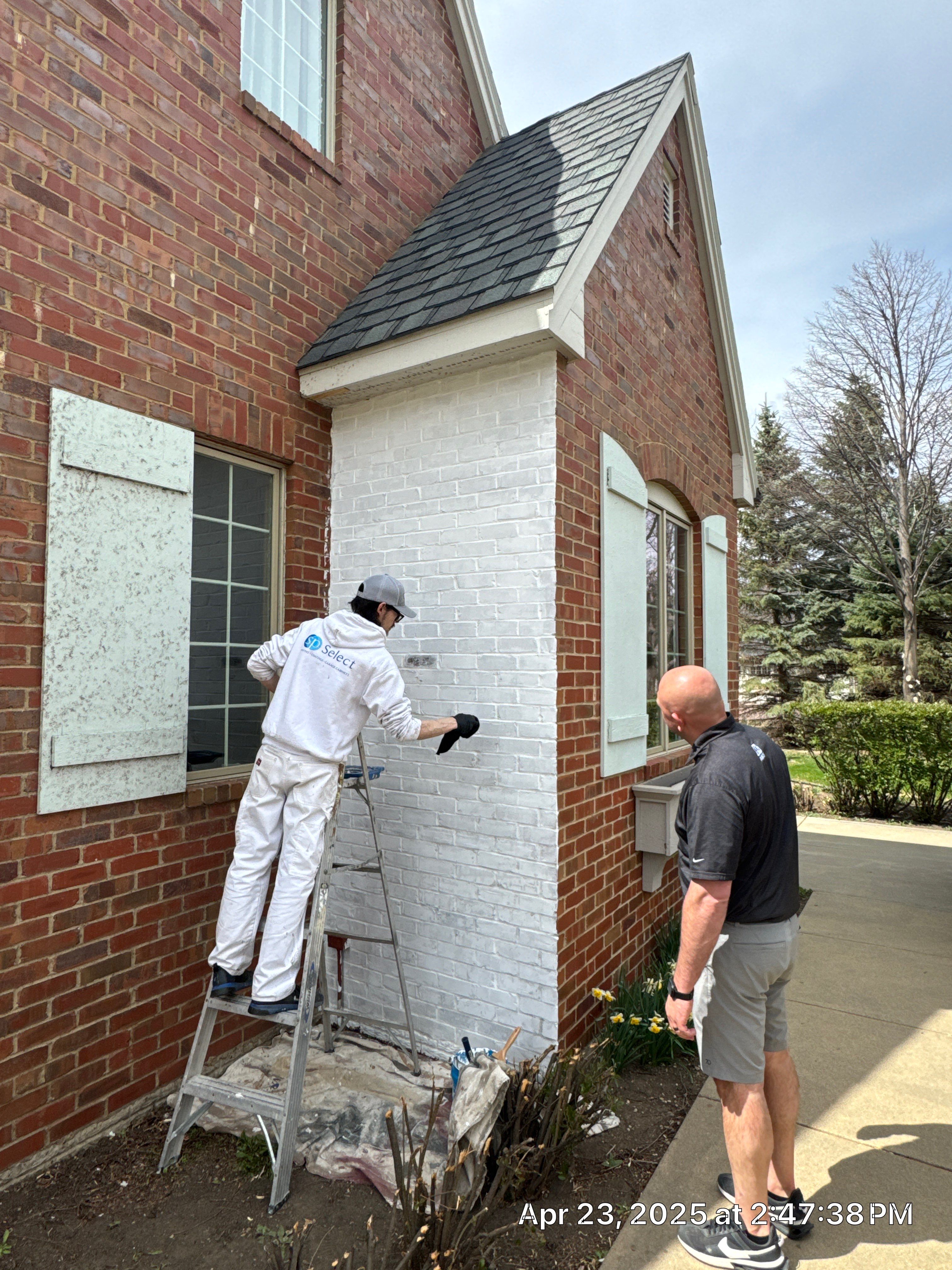 Residential Exterior Brick Painting and Limewash Refresh in Sioux Falls by Select Painting, Coatings & Garage Cabinets
