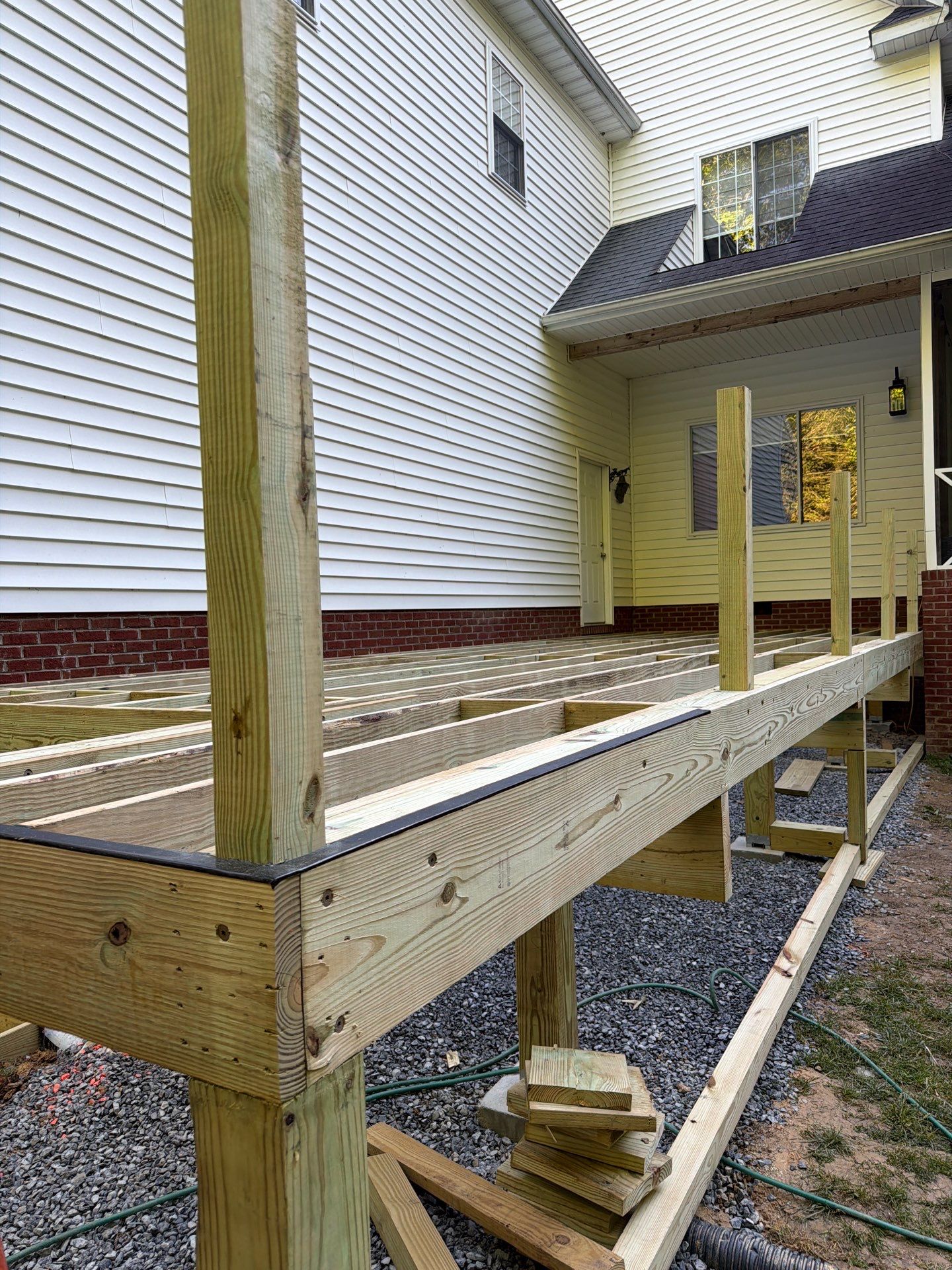 Custom Composite Deck and White Vinyl Railing Installation in Fayetteville by Walnut Hollow Decks & Outdoor Living
