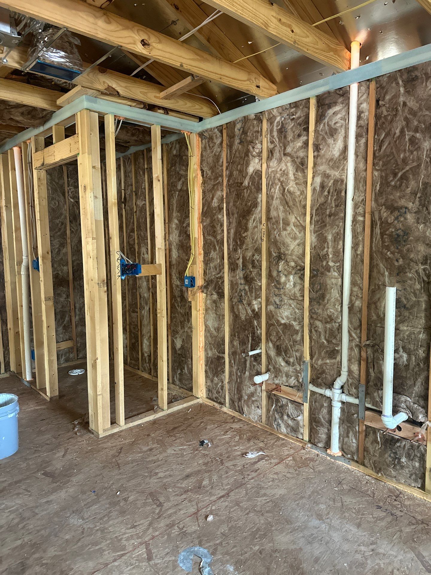 Fiberglass batt install on a second story addition in Dallas by Apex Insulation Solutions