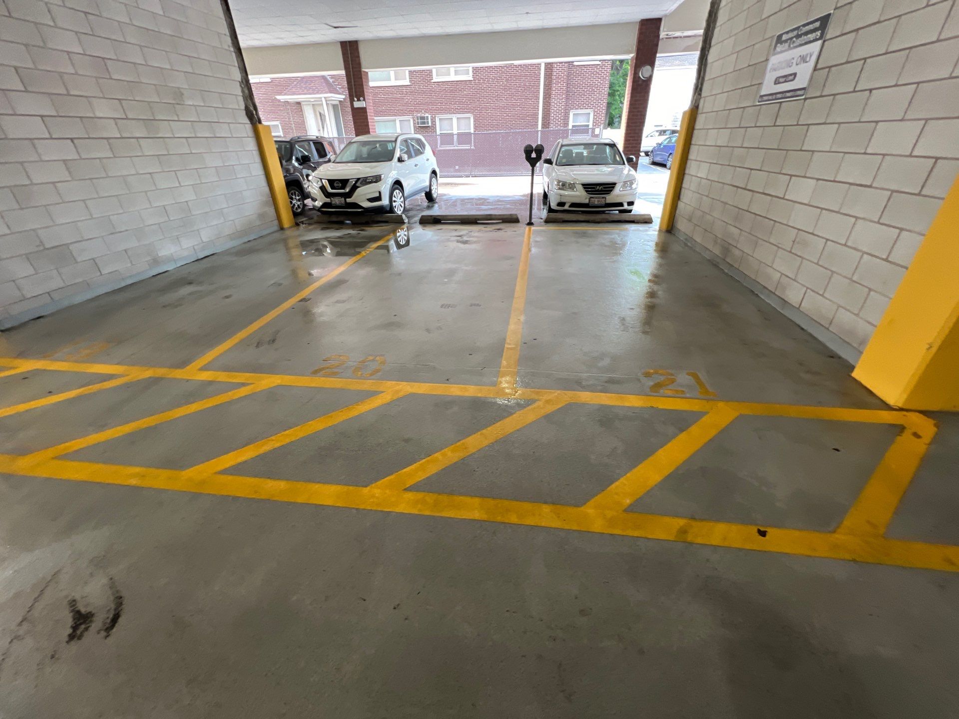 Parking garage using Hot water by Northern Power Washing LLC.