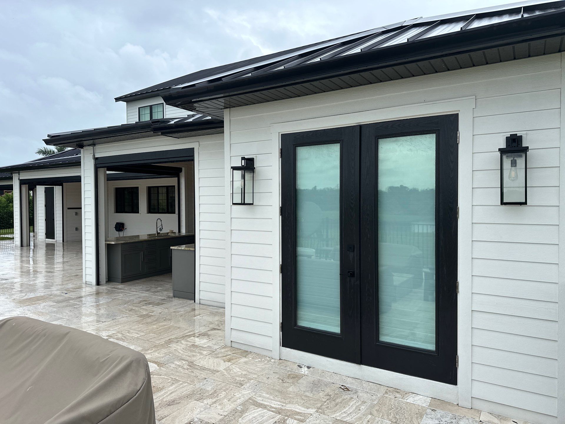 Complete Two-Story House Wash and Driveway Cleaning in Winding River Community, Bradenton, FL by Sunshine AquaWash