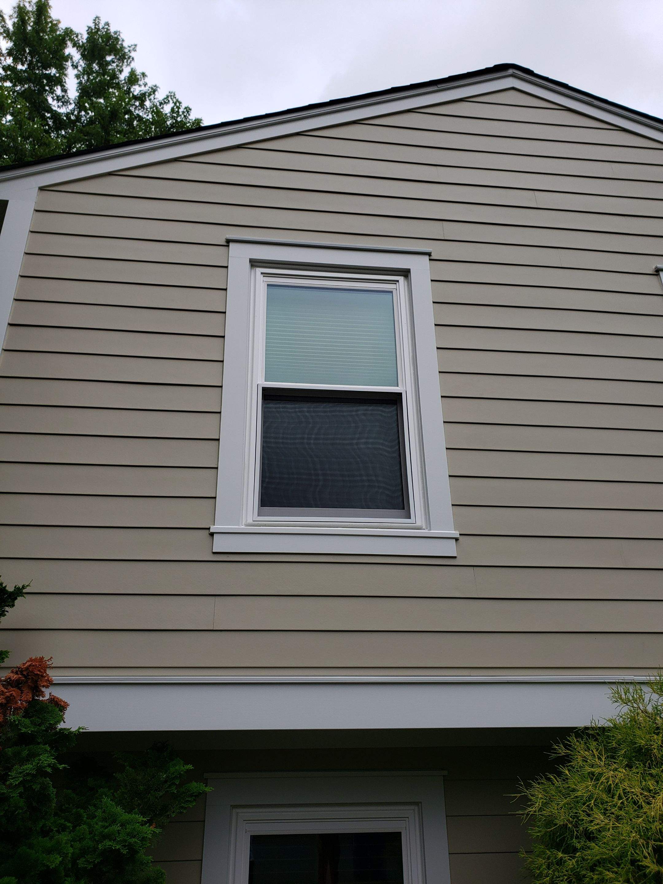 New composite windows and fiber cement siding with trim and gutters by Window Depot of Annapolis