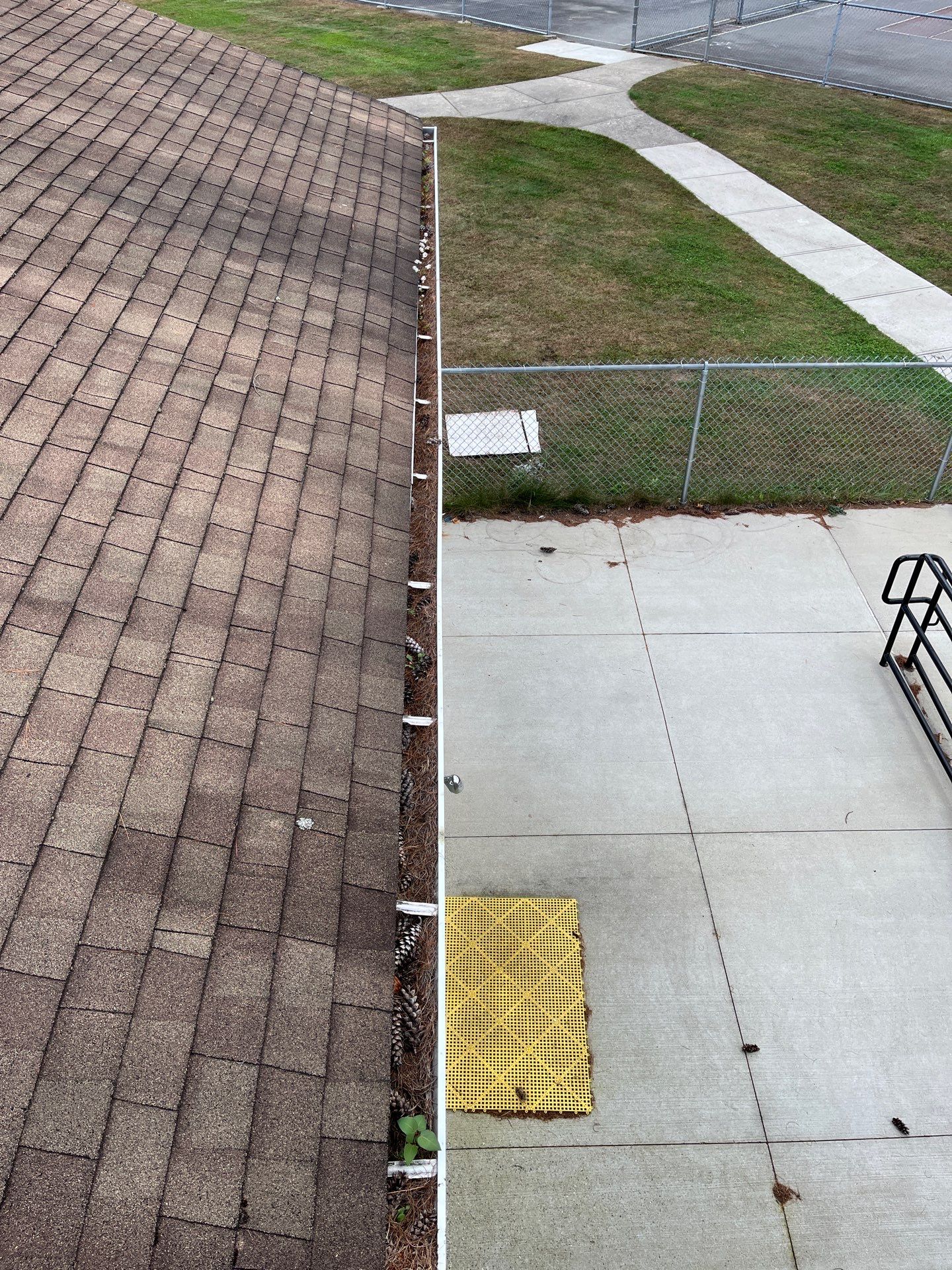 Commercial gutter cleaning Springfield before photo with filled gutters