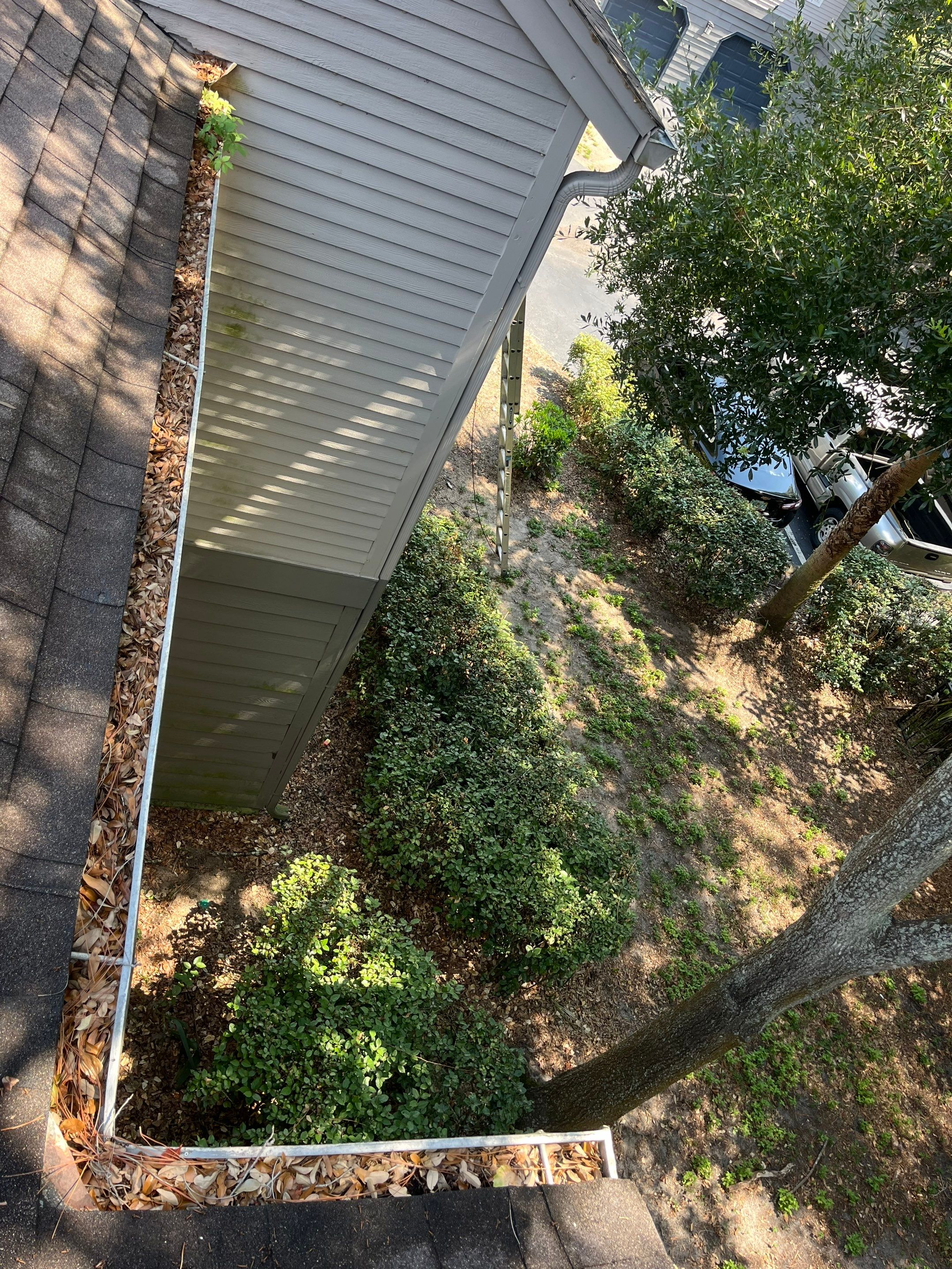 Commercial gutter cleaning Yulee, FL before photo with filled gutters