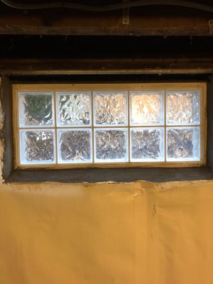 Basement Waterproofing using Drain tile system and a foundation wrap