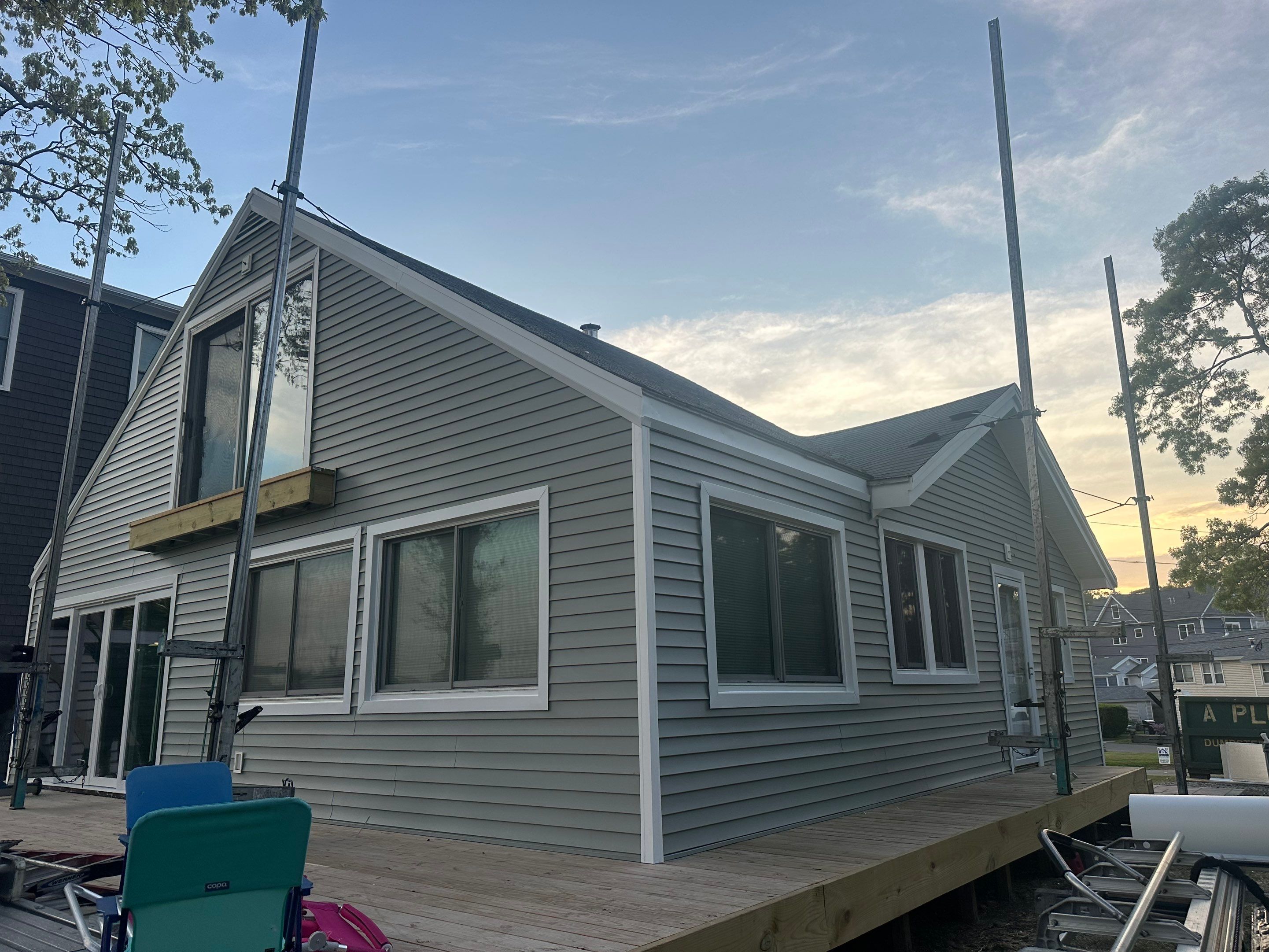 Milford Exterior Renovation Featuring Custom Siding and Wood Deck Installation by A Plus Exterior