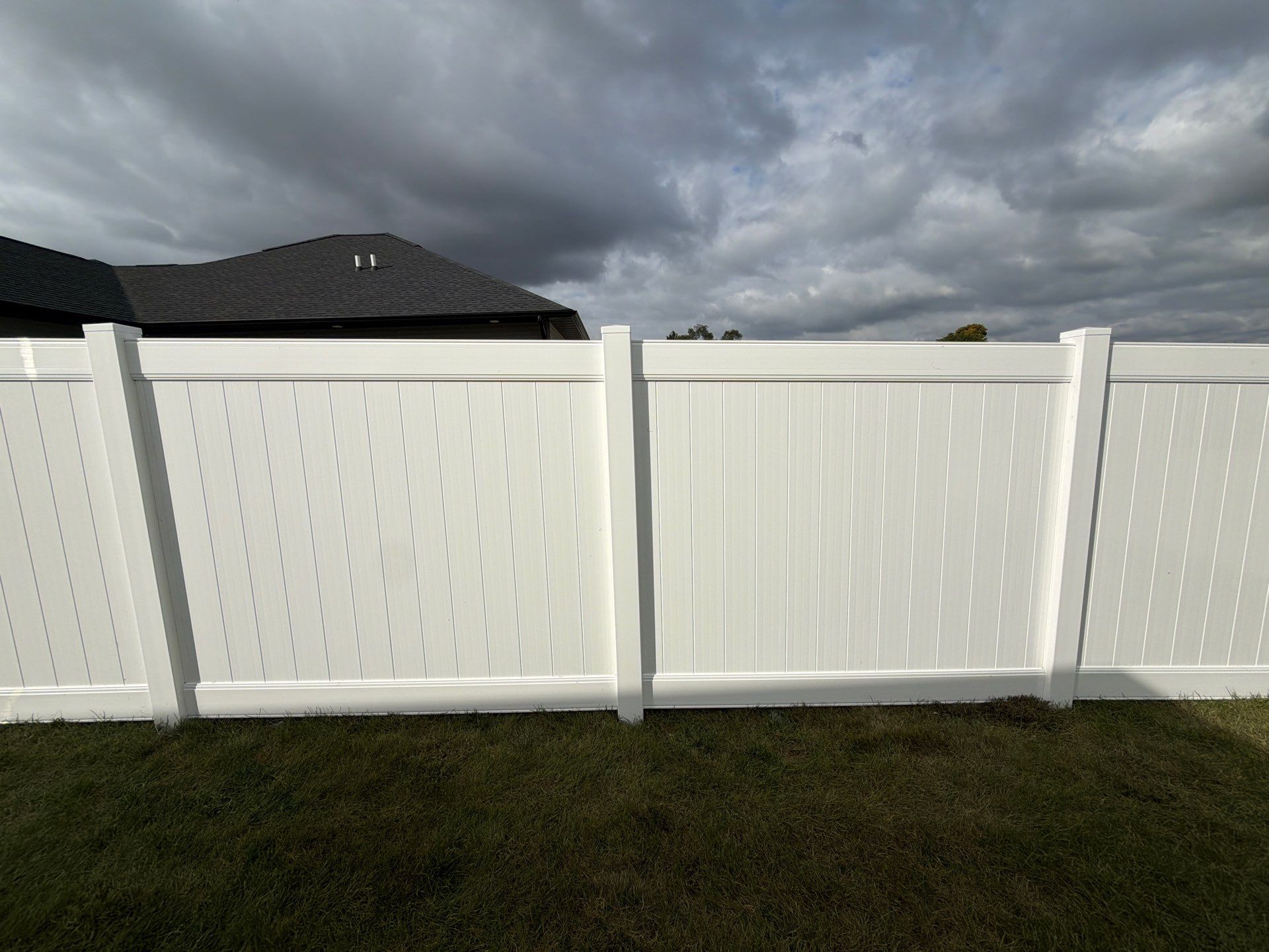 Residential White Vinyl Privacy Fence Installation in Janesville by Perfect Picket Fence and Stain
