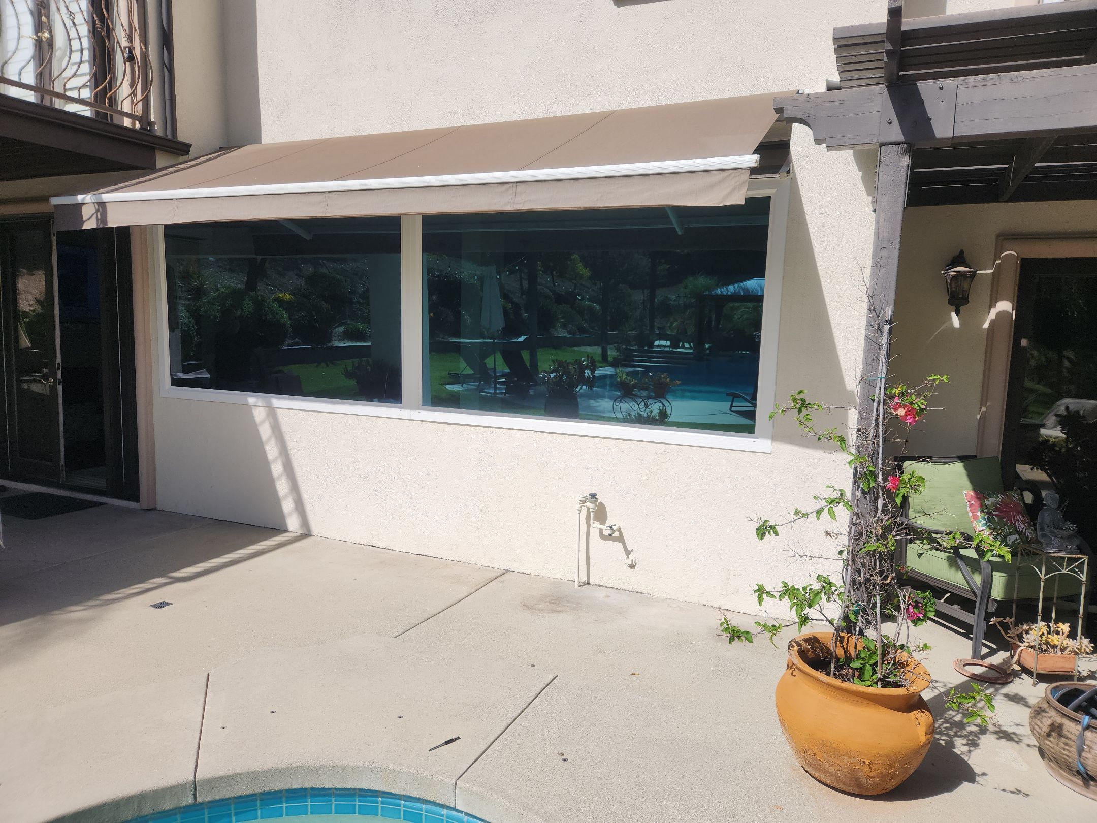Window Installation using Anlin vinyl windows with Sunshield glass by American Window Company