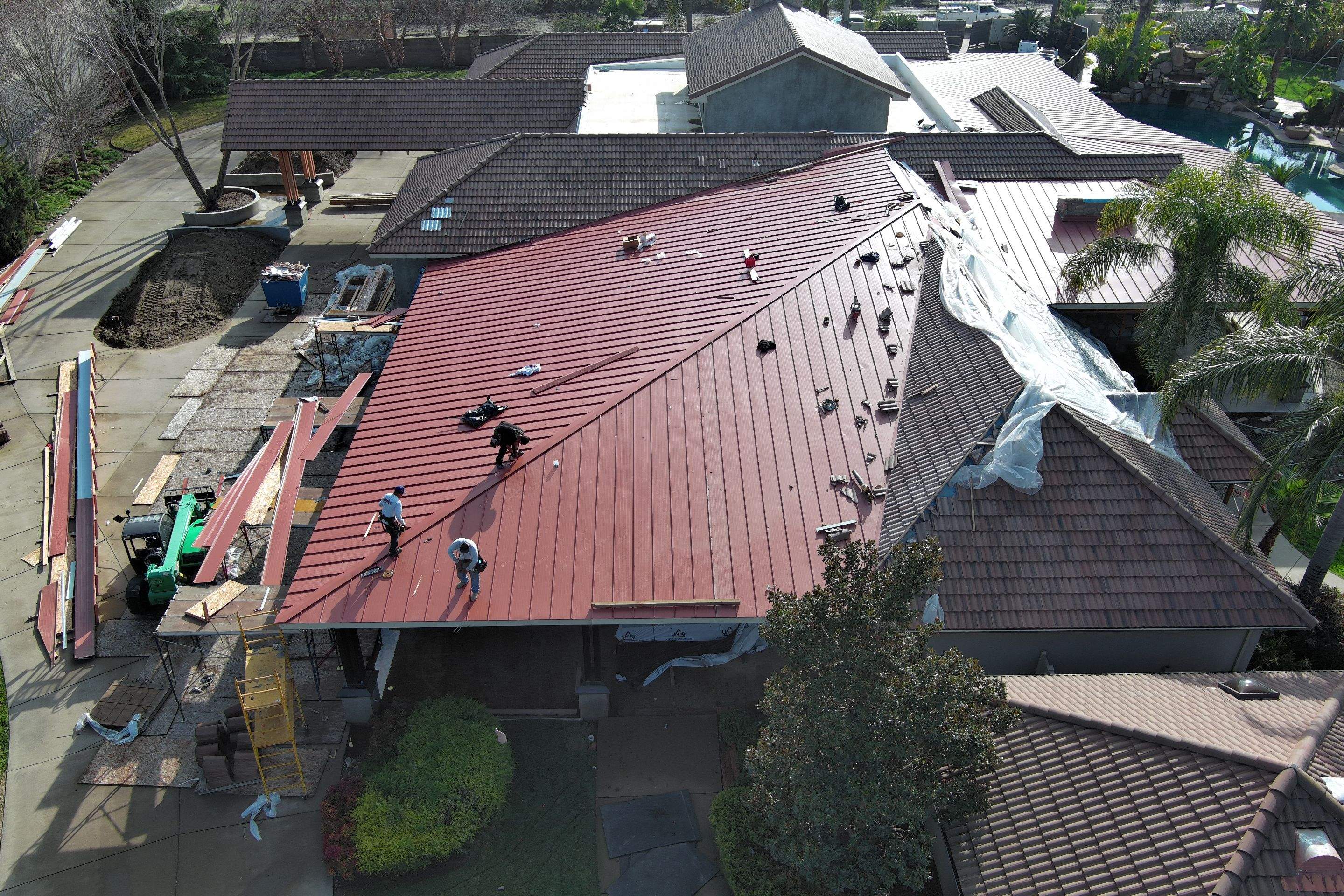 Tile, Metal, and TPO roofing project (new construction) by Straight Edge Roofing Inc