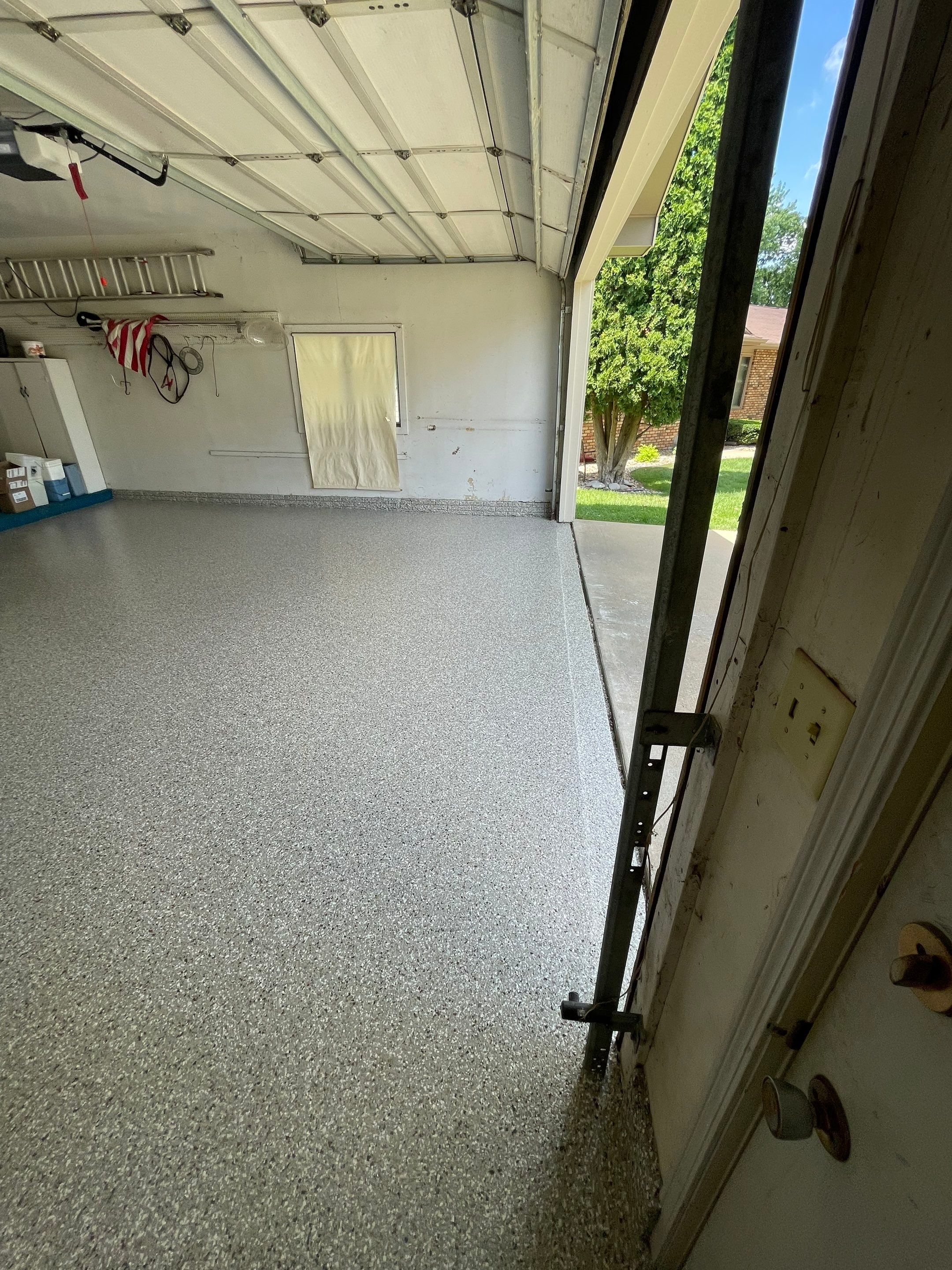 Custom Creekbed Garage Floor Coating in Sioux Falls by Select Painting, Coatings & Garage Cabinets