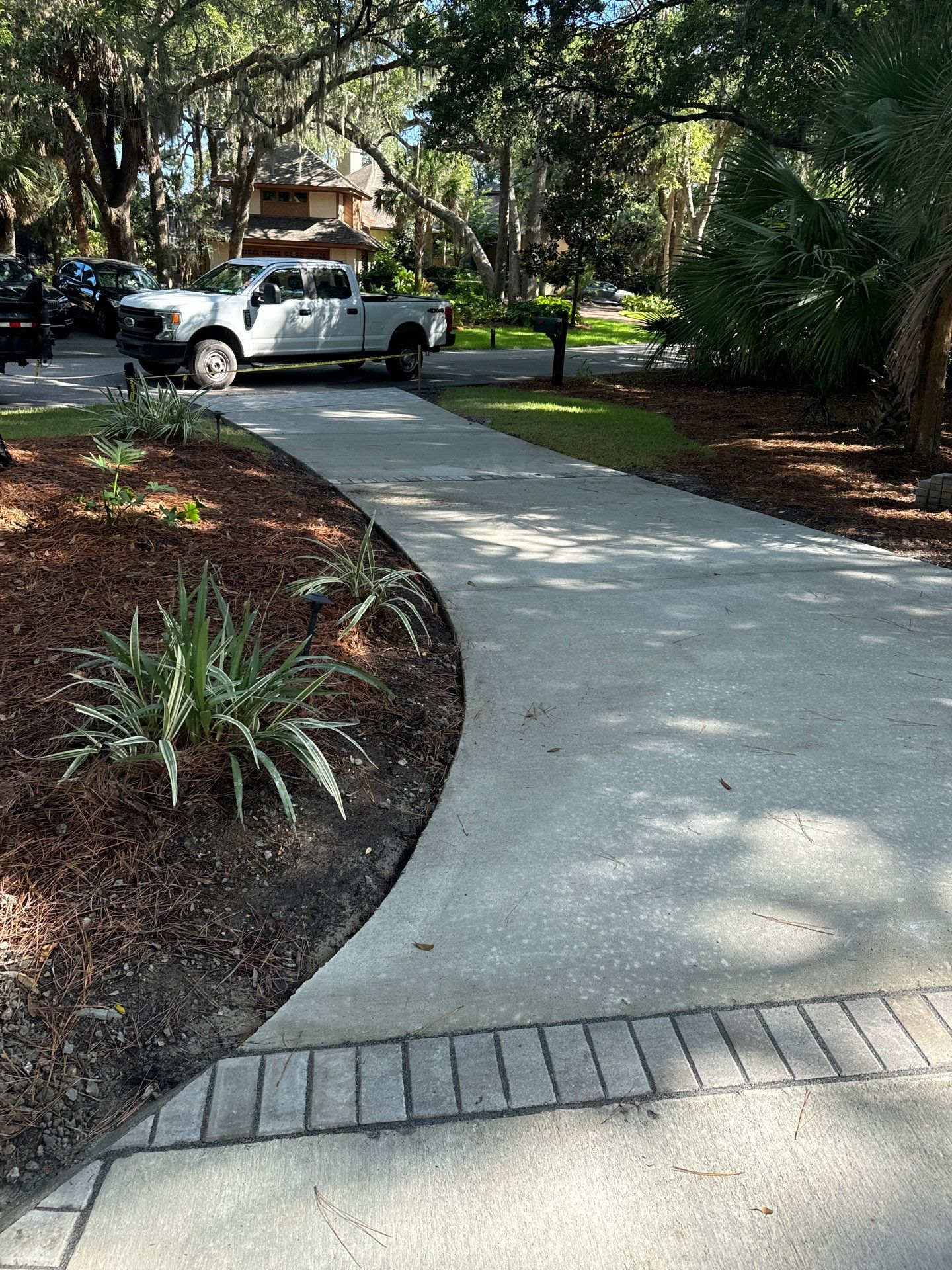 Hilton Head Island Concrete Driveway Replacement with Decorative Paver Borders by Lowcountry Scapes, LLC