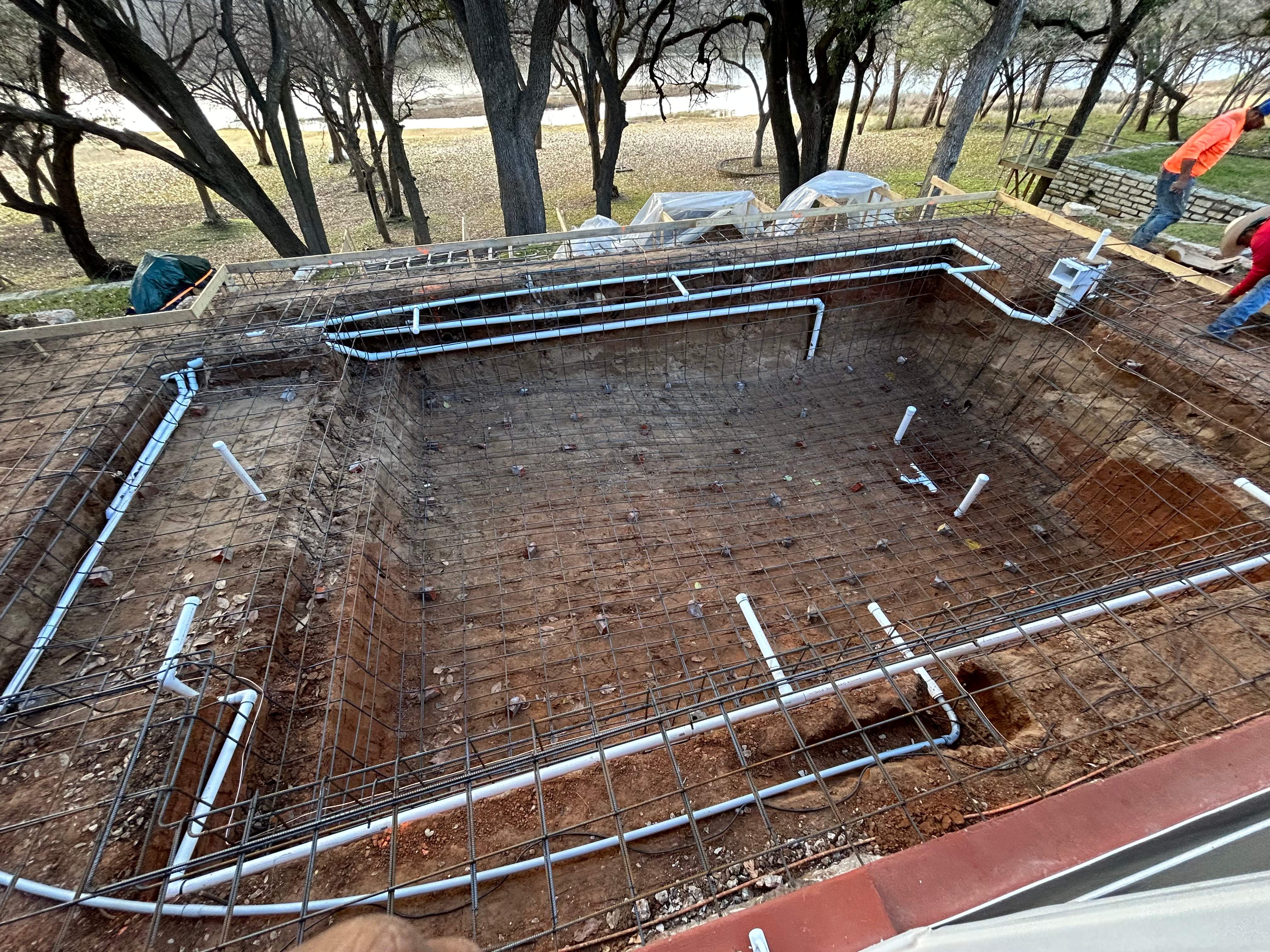 Geometric Pool with Raised Stone Wall and Flagstone Decking by Pinnacle Pools and Spas - DFW