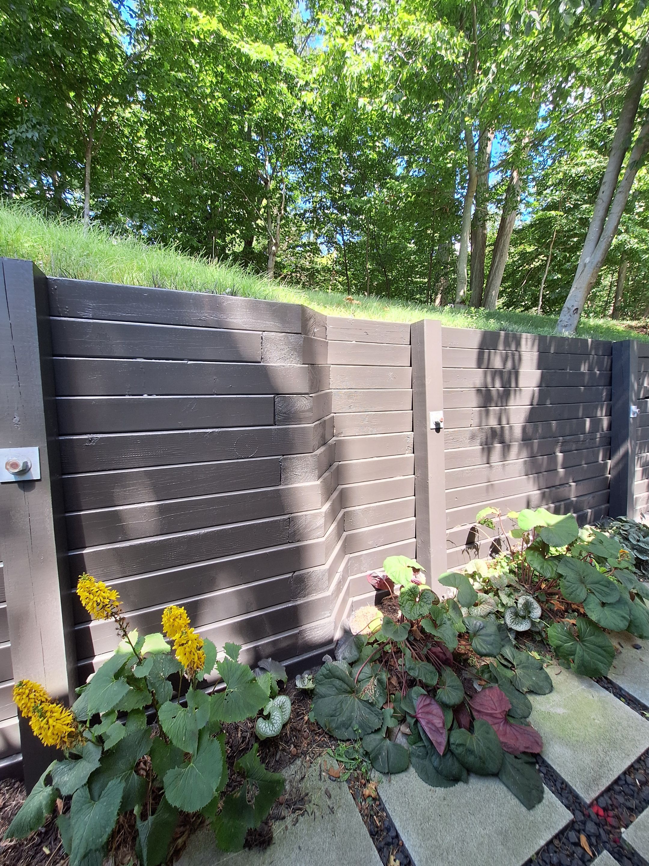 Exterior Retaining Wall Painting | Grand Haven, Michigan by Gordon Painting