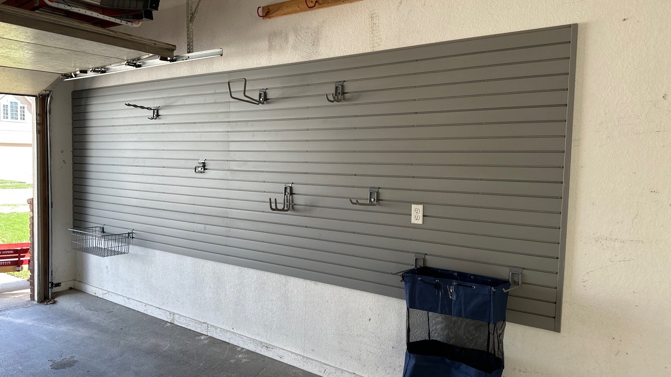 Melissa L. upgraded her garage with slatwall and overhead racks by Banner Garage