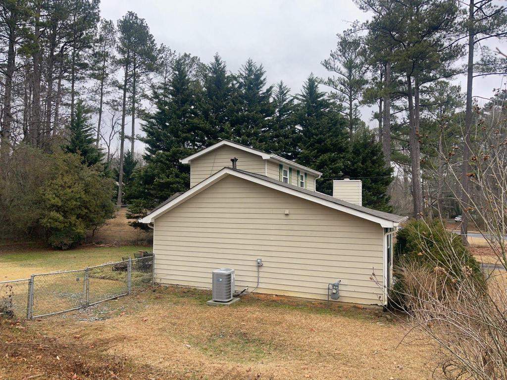 Marietta, GA Siding, Rotten Wood, Front Door, and Gutter Replacement with Exterior Painting by Nelson Exteriors