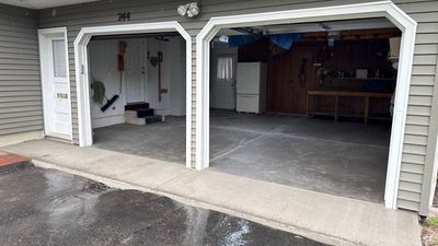 Concrete garage floor replacement with a broom finished apron