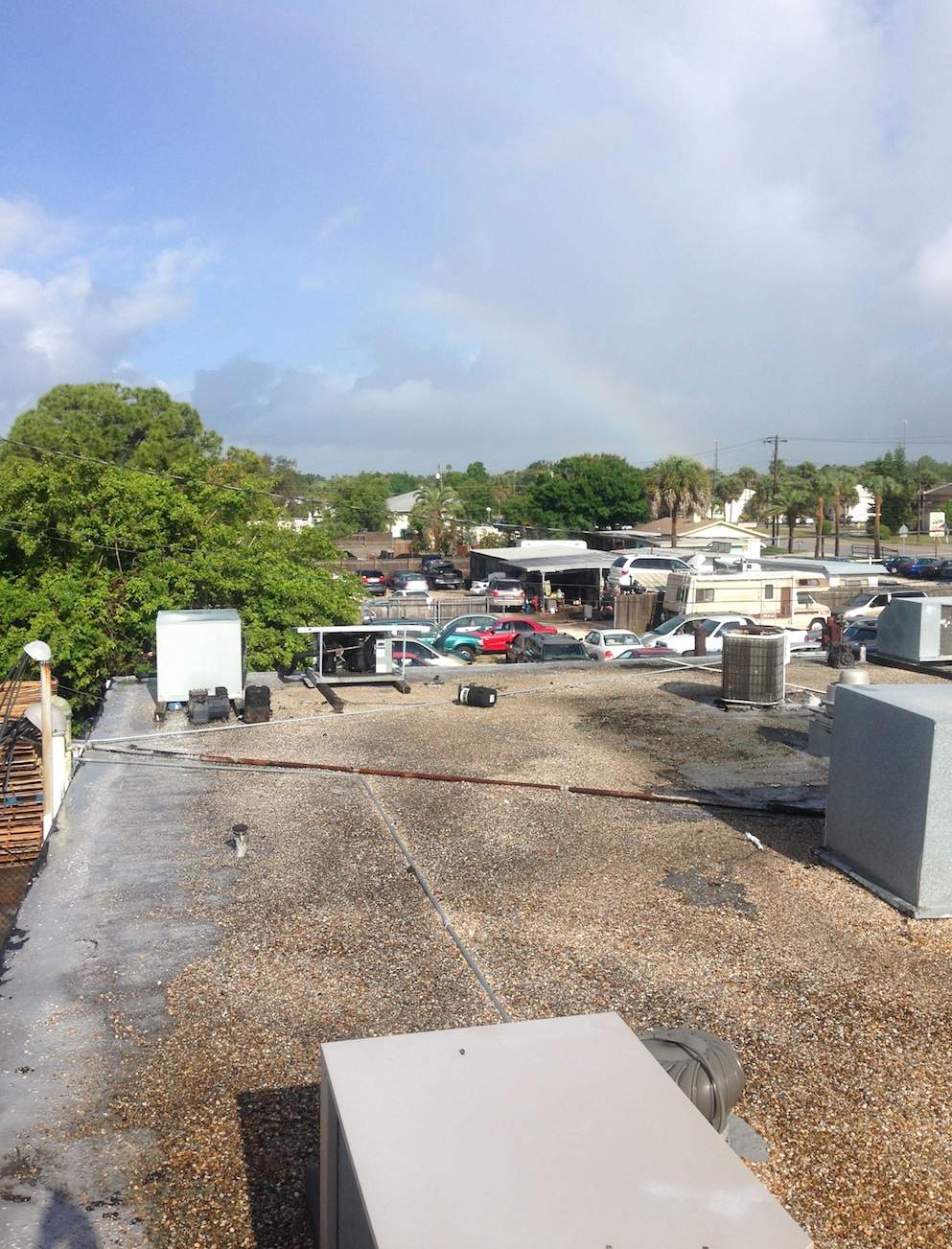 White Reflective Commercial Roof Coating Installation in Melbourne FL by Florida Roofing and Renovations Inc.