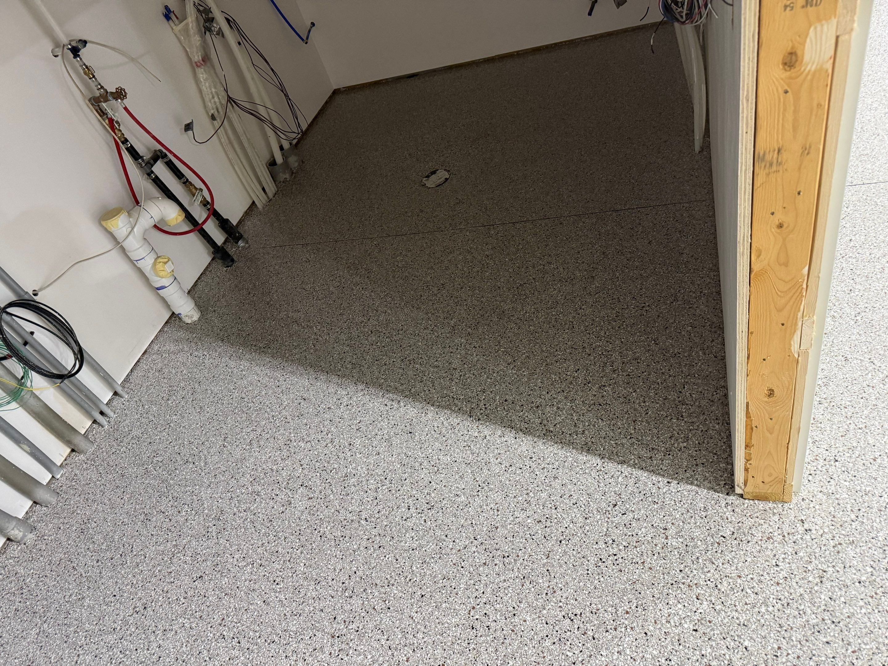 Custom Speckled Floor Coating for Large Montrose Shop by Select Painting, Coatings & Garage Cabinets