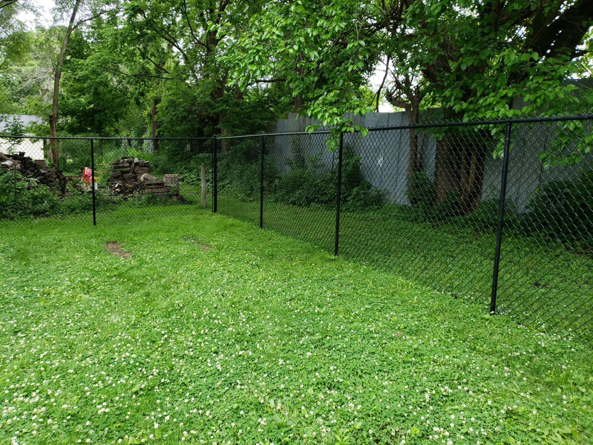 Black Vinyl Chain Link Fence Installation in Charles City by Perfect Picket Fence and Stain