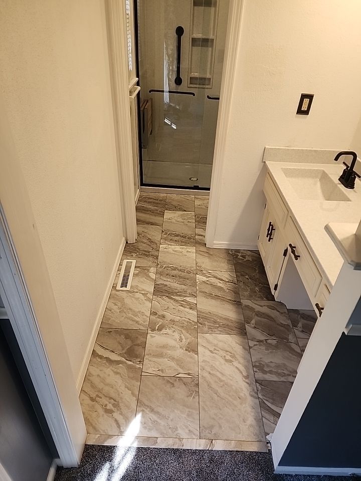 New shower, flooring, and countertop by The Shower Company