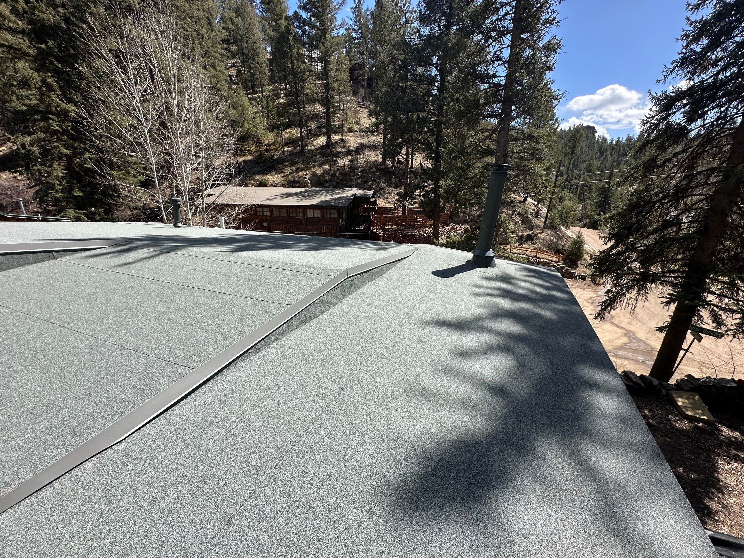 Residential Roofing Installation using Modified Bitumen Roofing by Blue Peaks Roofing LLC 