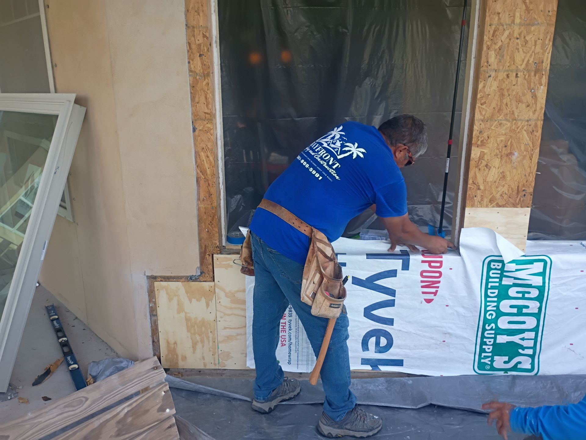 Installing Windows on a Submarine  by Bayfront Roofing and Construction