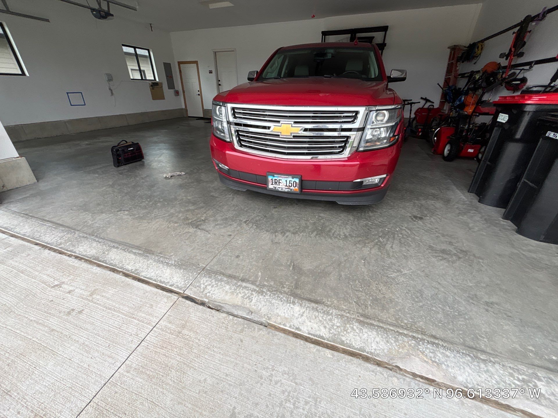 Full Garage Concrete Coating with Grey Speckled Epoxy in Brandon by Select Painting, Coatings & Garage Cabinets