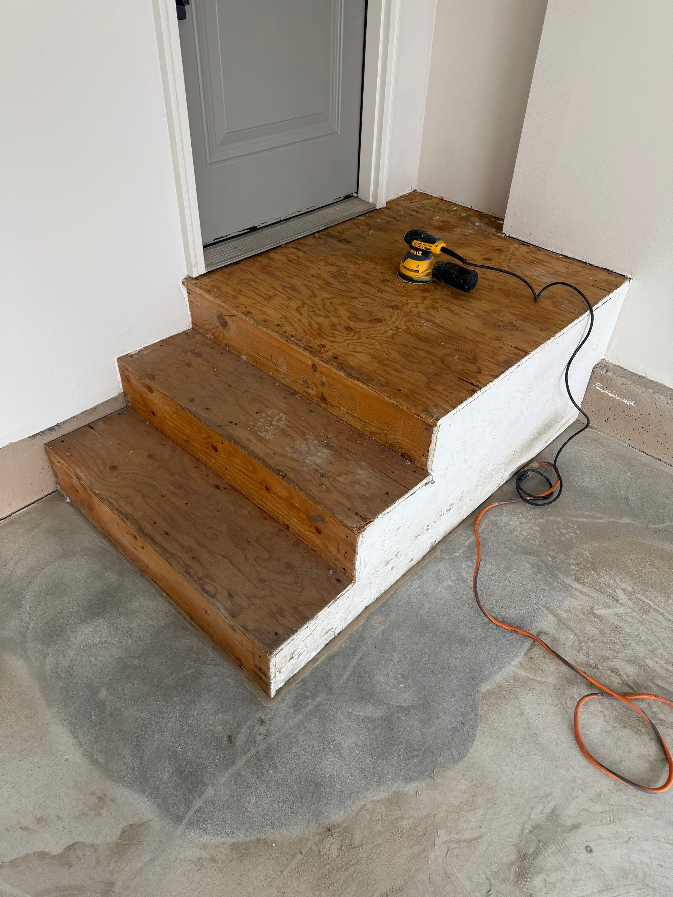 Residential Garage Floor Coating with Grey Speckled Epoxy Finish by Select Painting, Coatings & Garage Cabinets