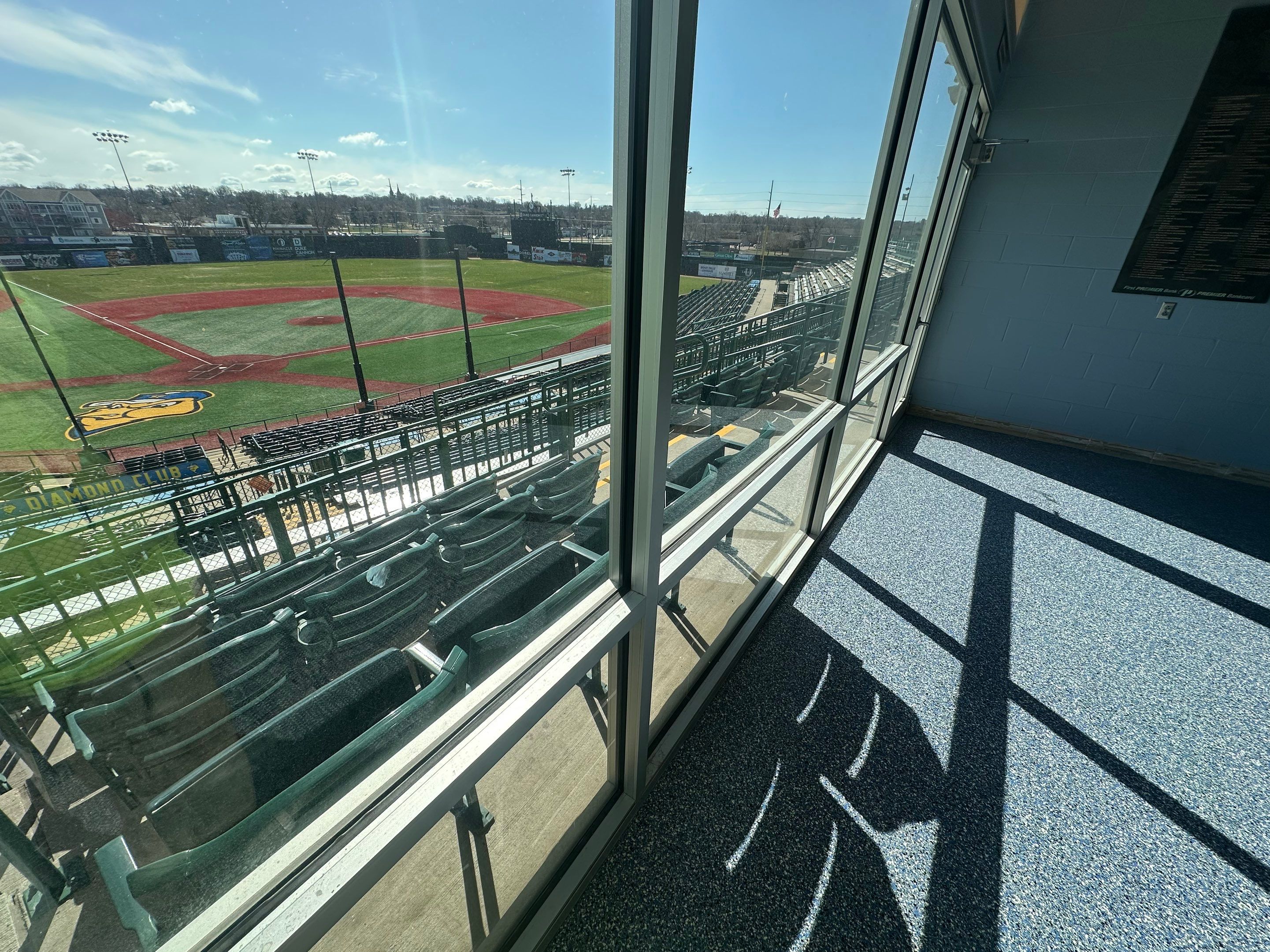 Commercial Epoxy Floor Coating for Stadium Viewing Suites in Sioux Falls by Select Painting, Coatings & Garage Cabinets