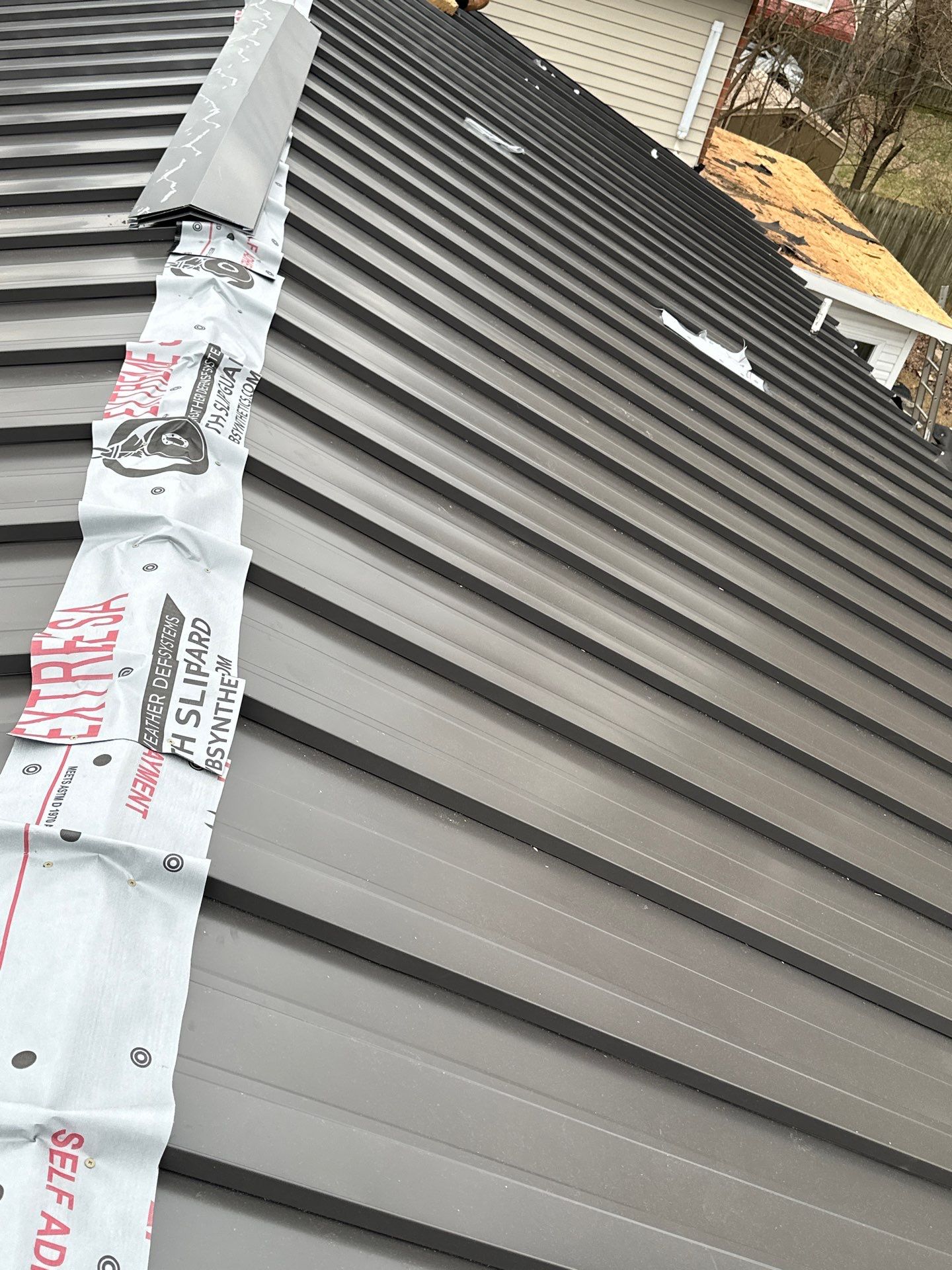 Residential Roofing Installation using Standing Seam Metal by Undersun Roofing 
