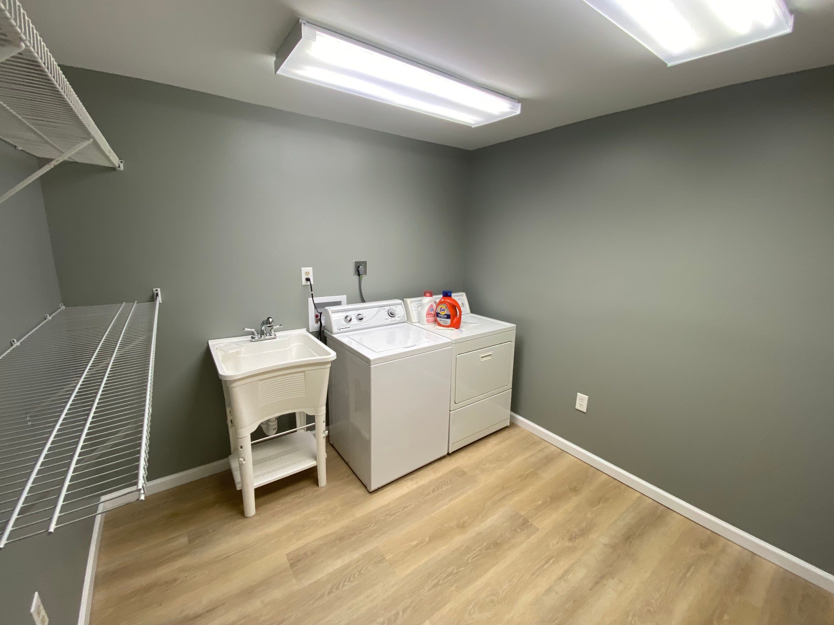 Laundry Room Redmodel using Lifeproof Luxury Vinyl Plank Flooring by The Smet Companies, LLC
