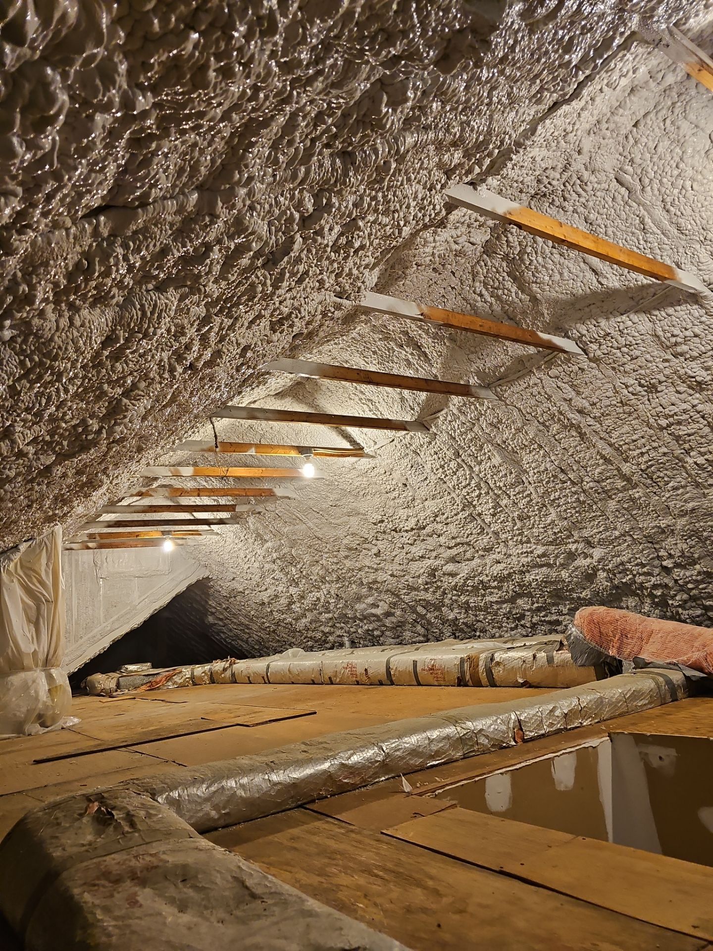 Attic Retrofit using open cell spray foam by NYS Foam & Energy