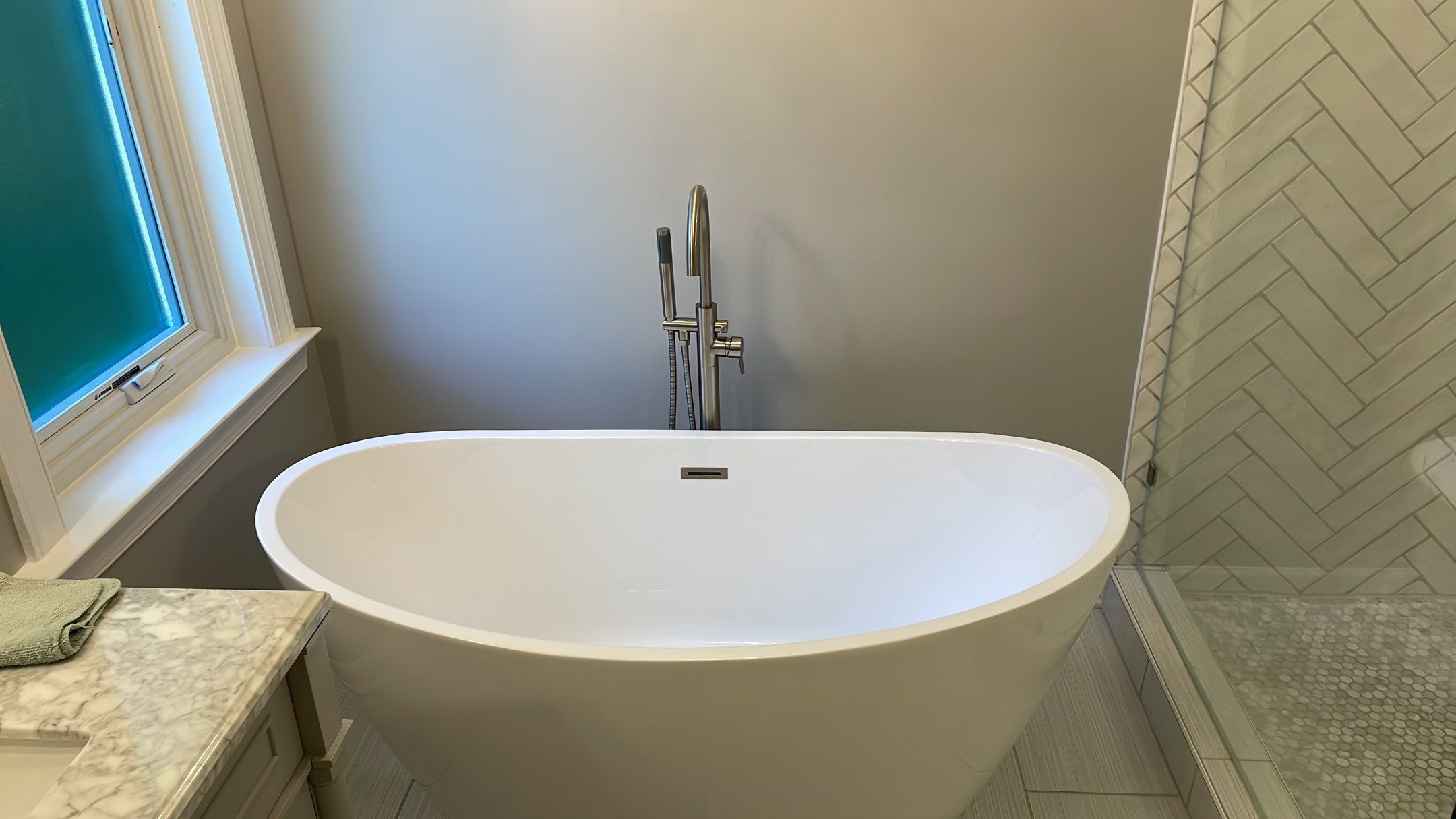 Bathroom Remodel using Schluter by Footprints Floors of Coastal Carolina