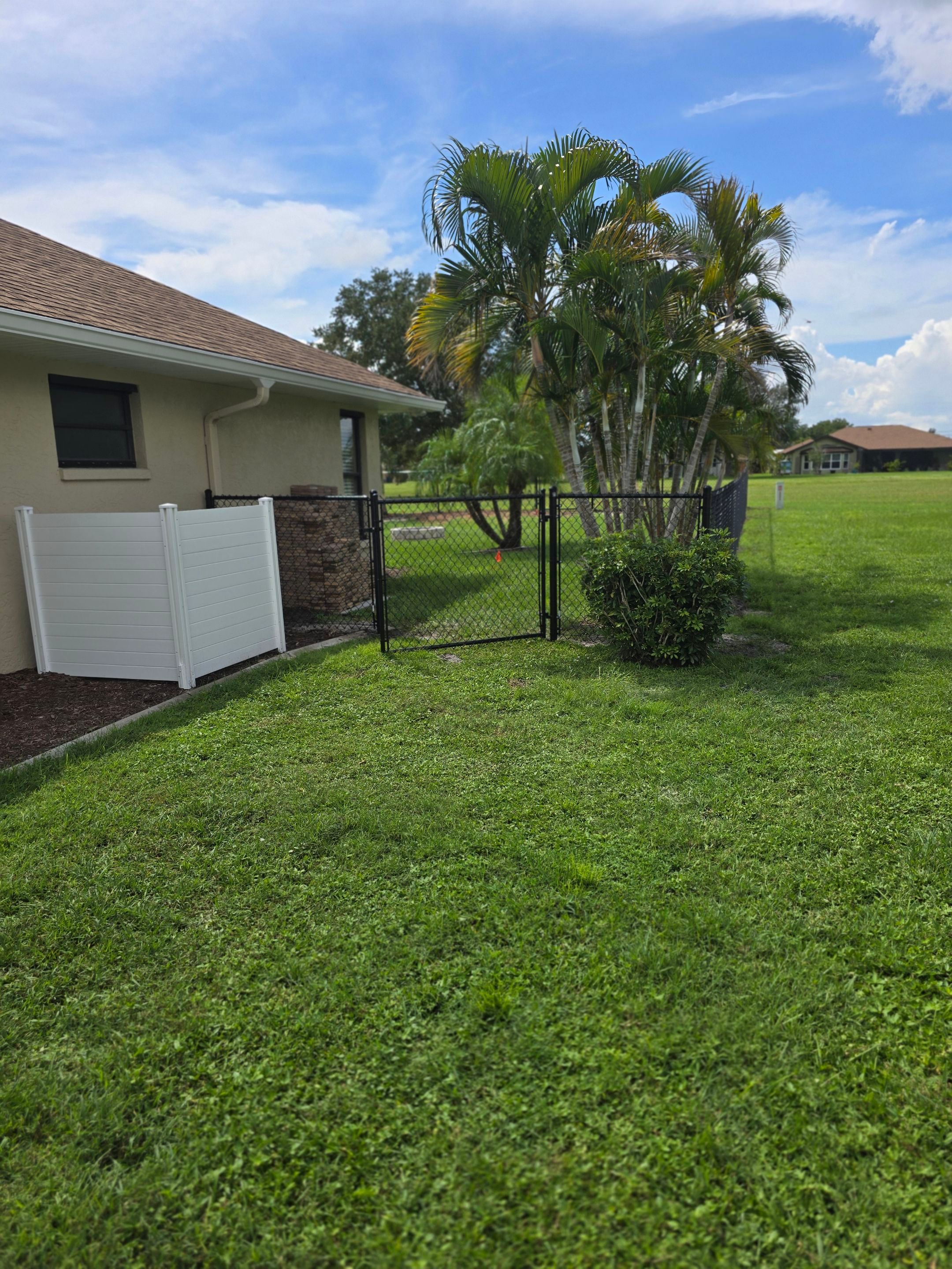 Black Vinyl-Coated Chain Link Fence Installation in Punta Gorda by True Fence LLC